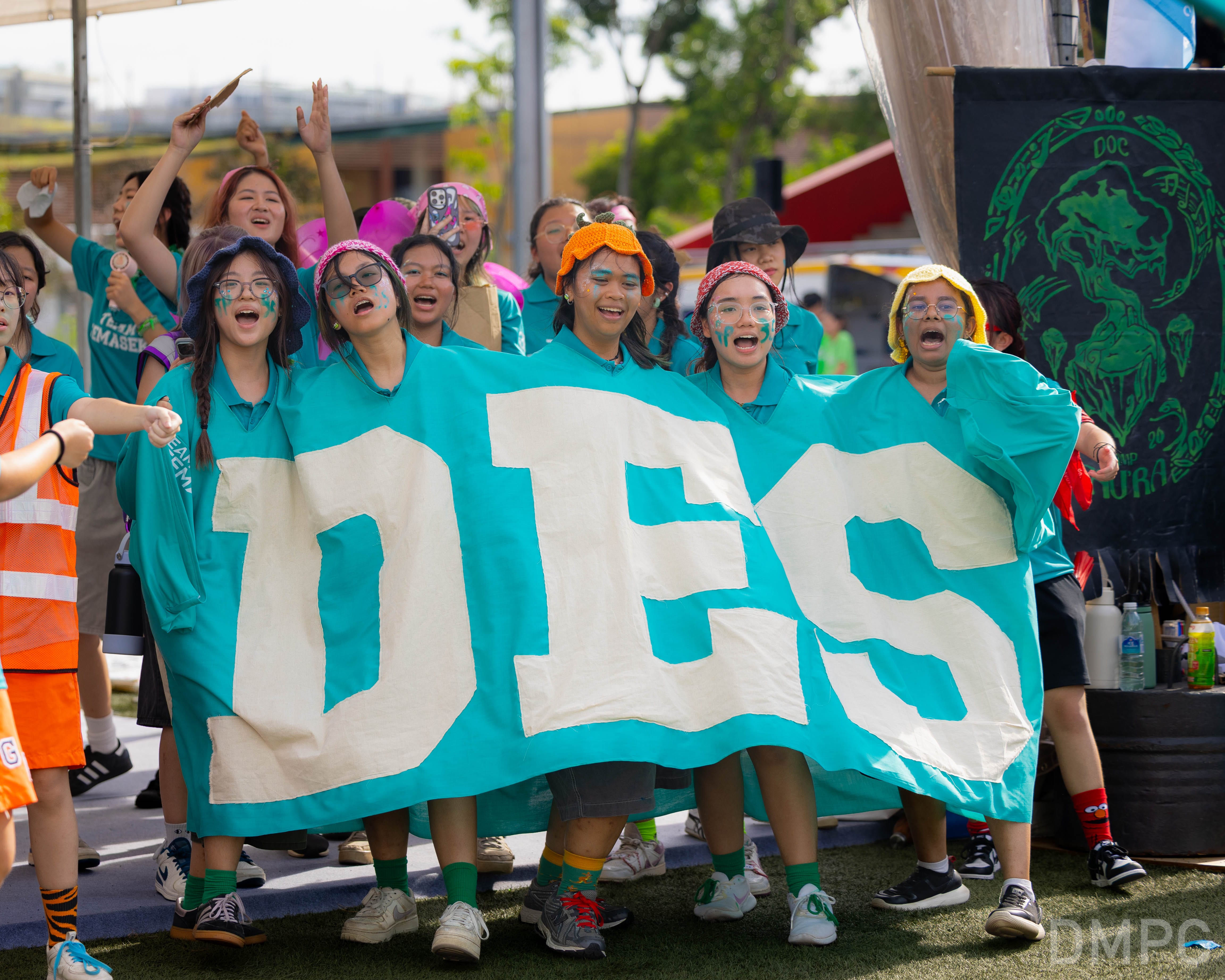 Image of a group of students from School of Design cheering at the finale