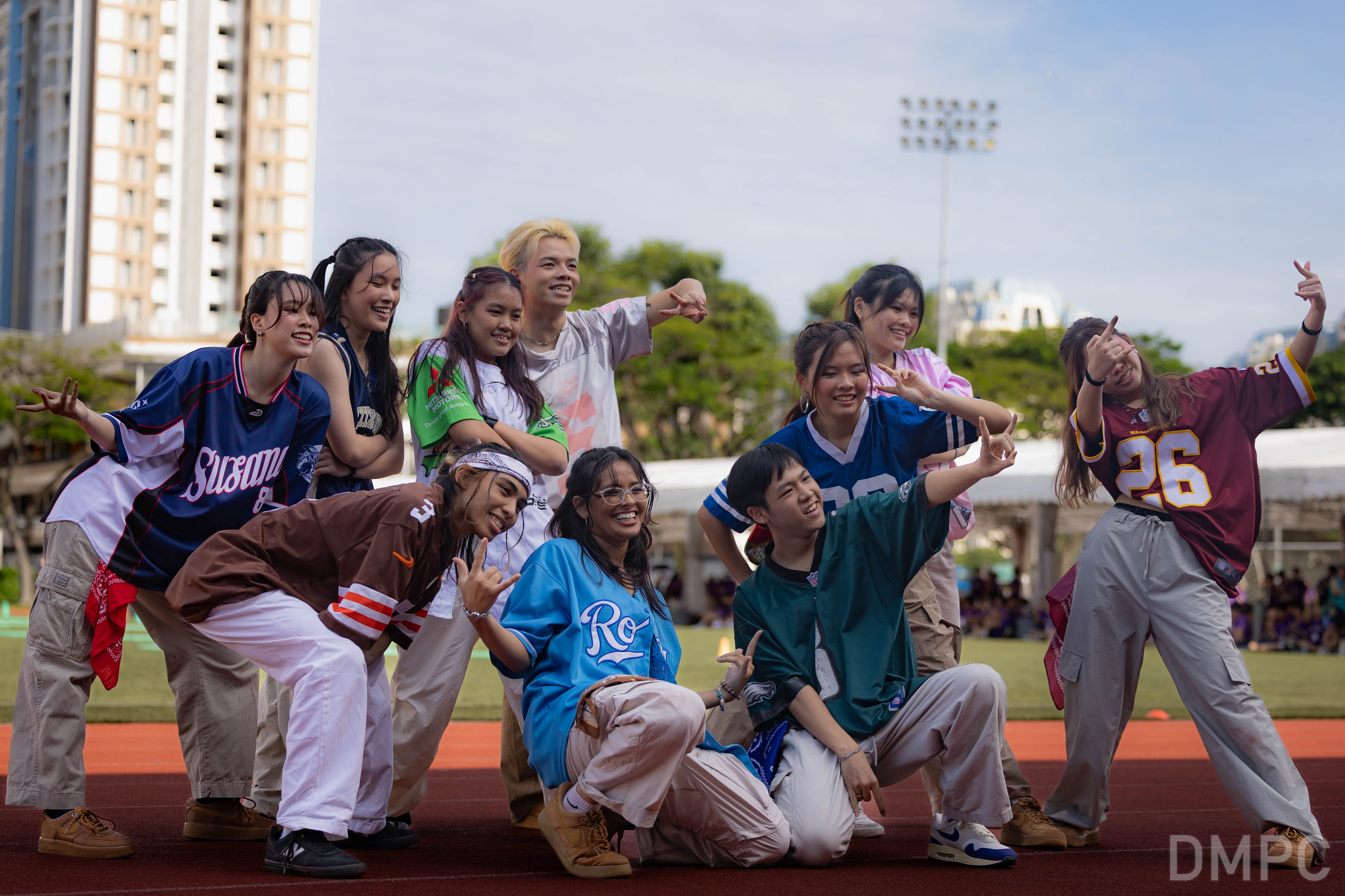 Image of a group of TP Dance Ensemble performers dancing at the finale