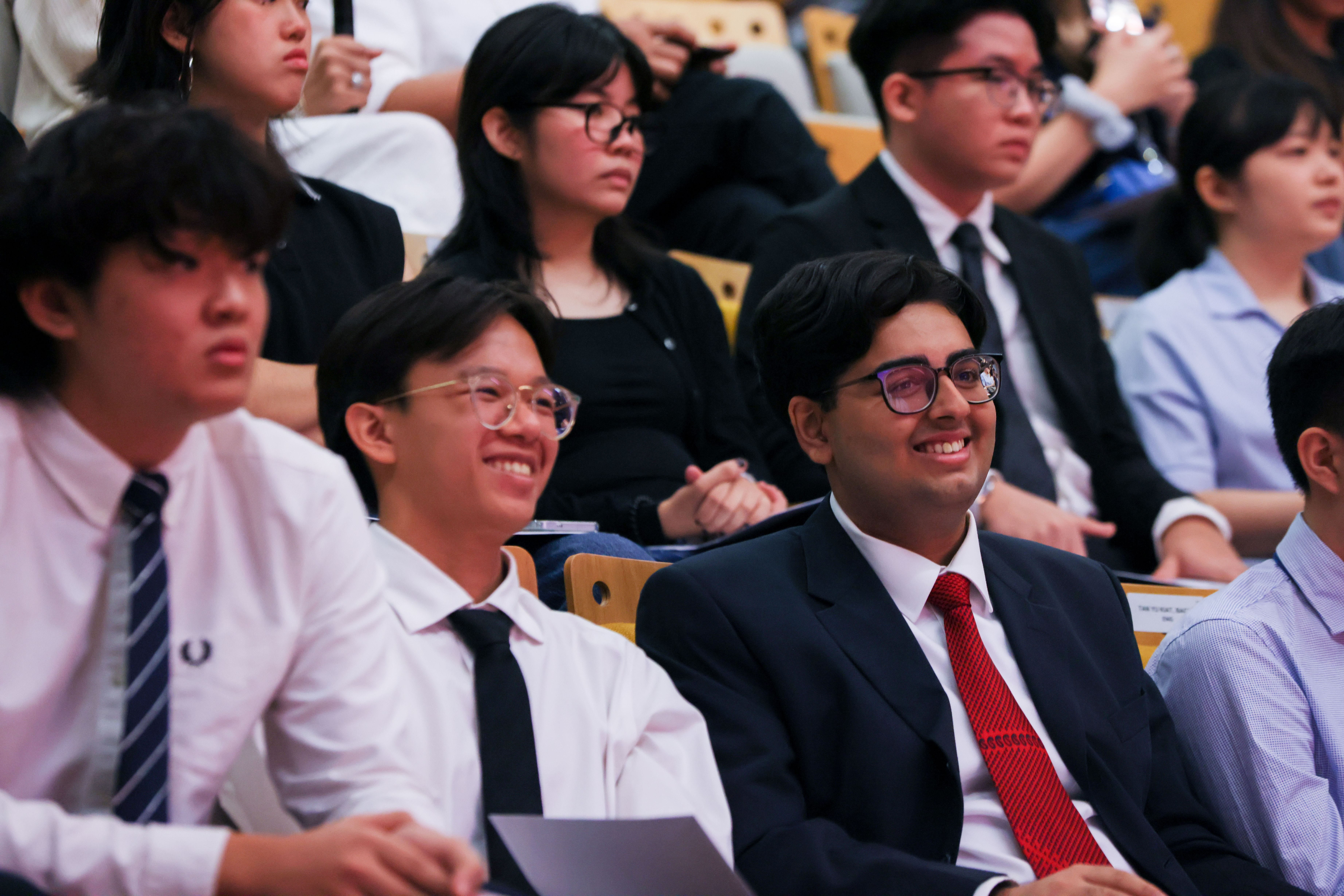 Image of the audience viewing and smiling at the proceedings at the TP Scholarships Presentation