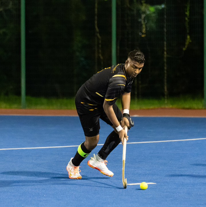 Image of a Hockey member playing the sport