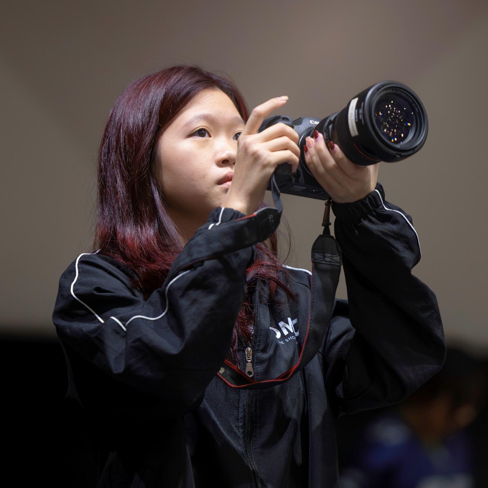 Image of a DMPC member working behind-the-scenes at an event 2