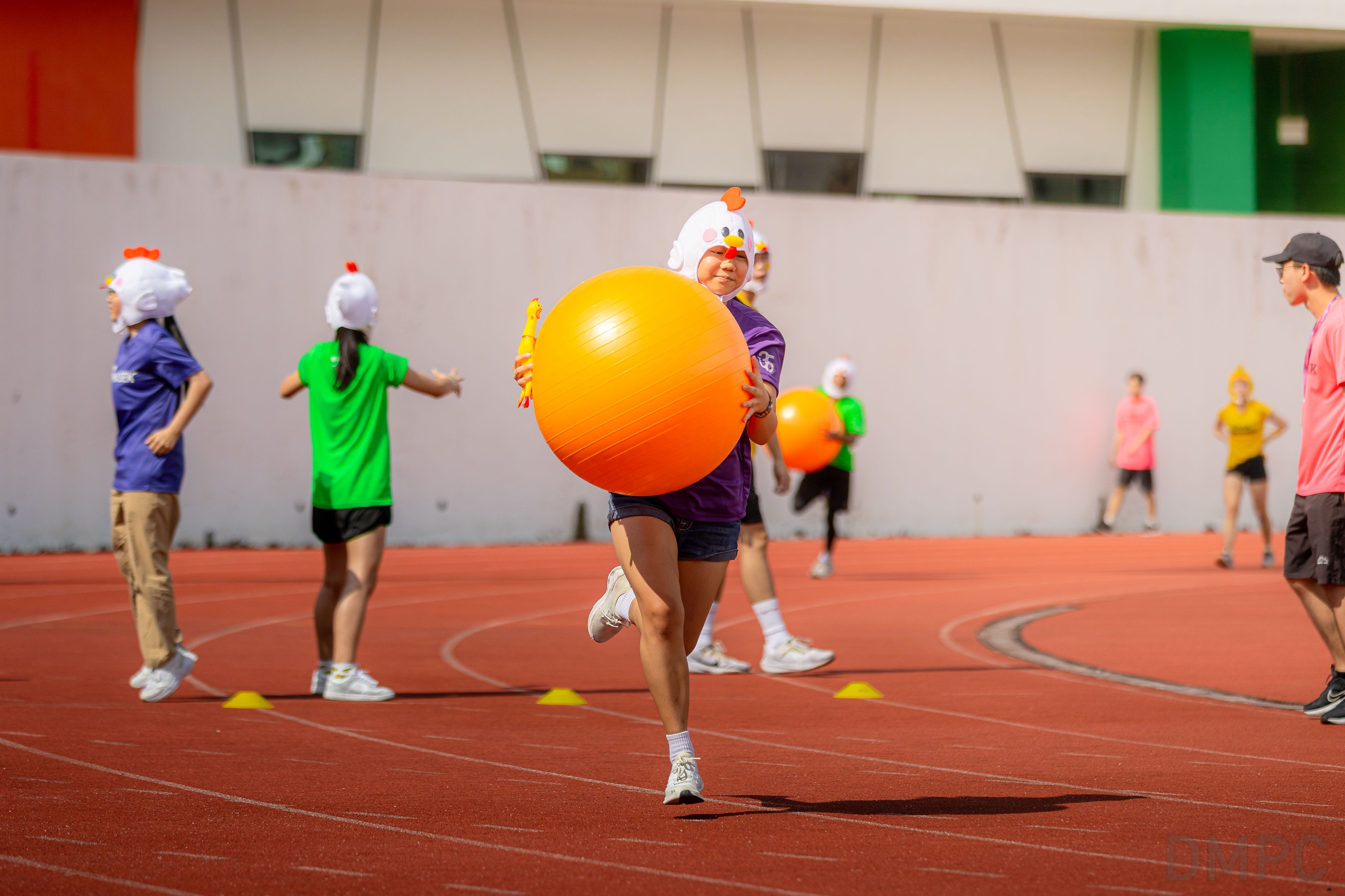 Image of Olympiad participants playing a ball game at the finale