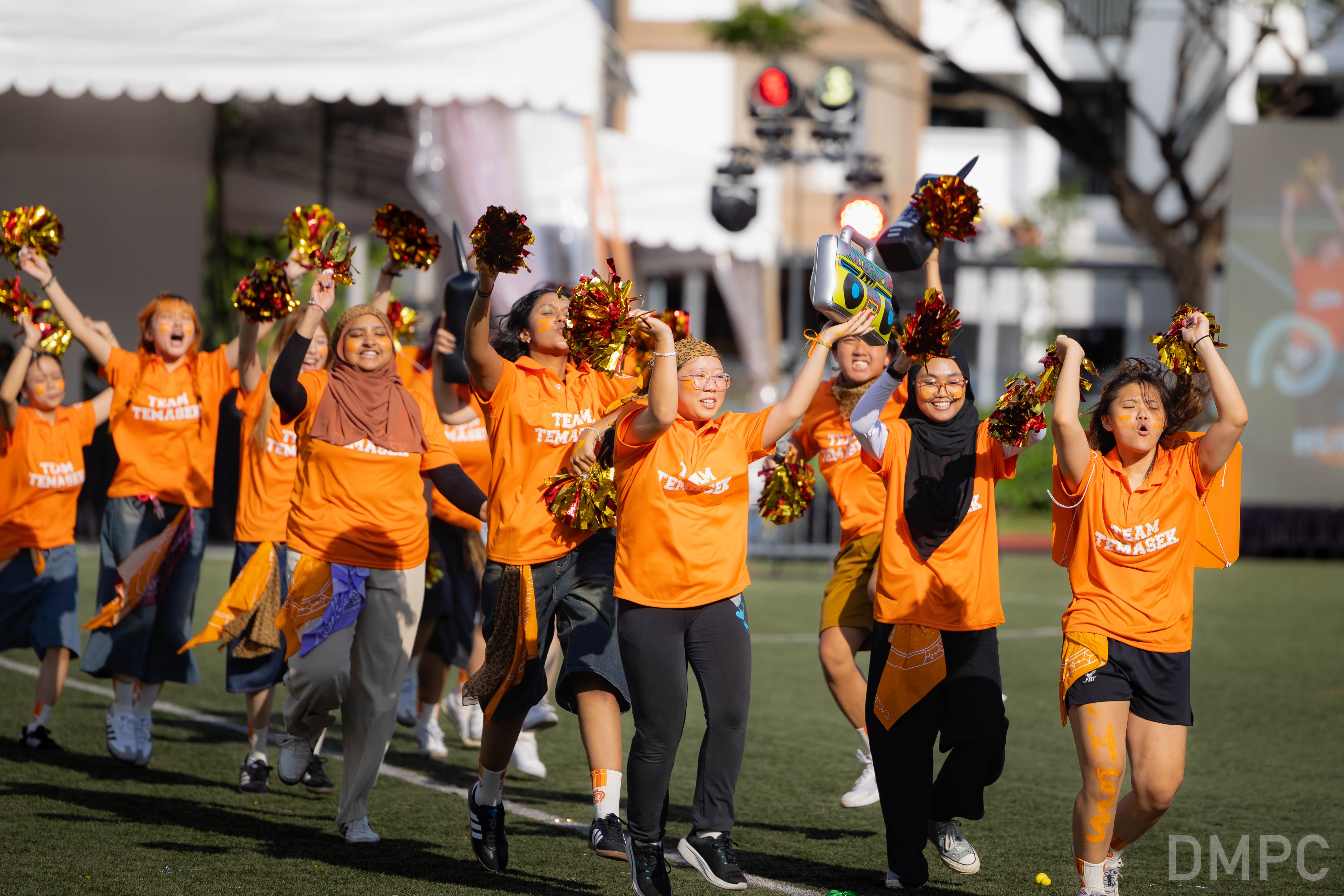Image of a group of students from School of Humanities & Social Sciences cheering at the finale