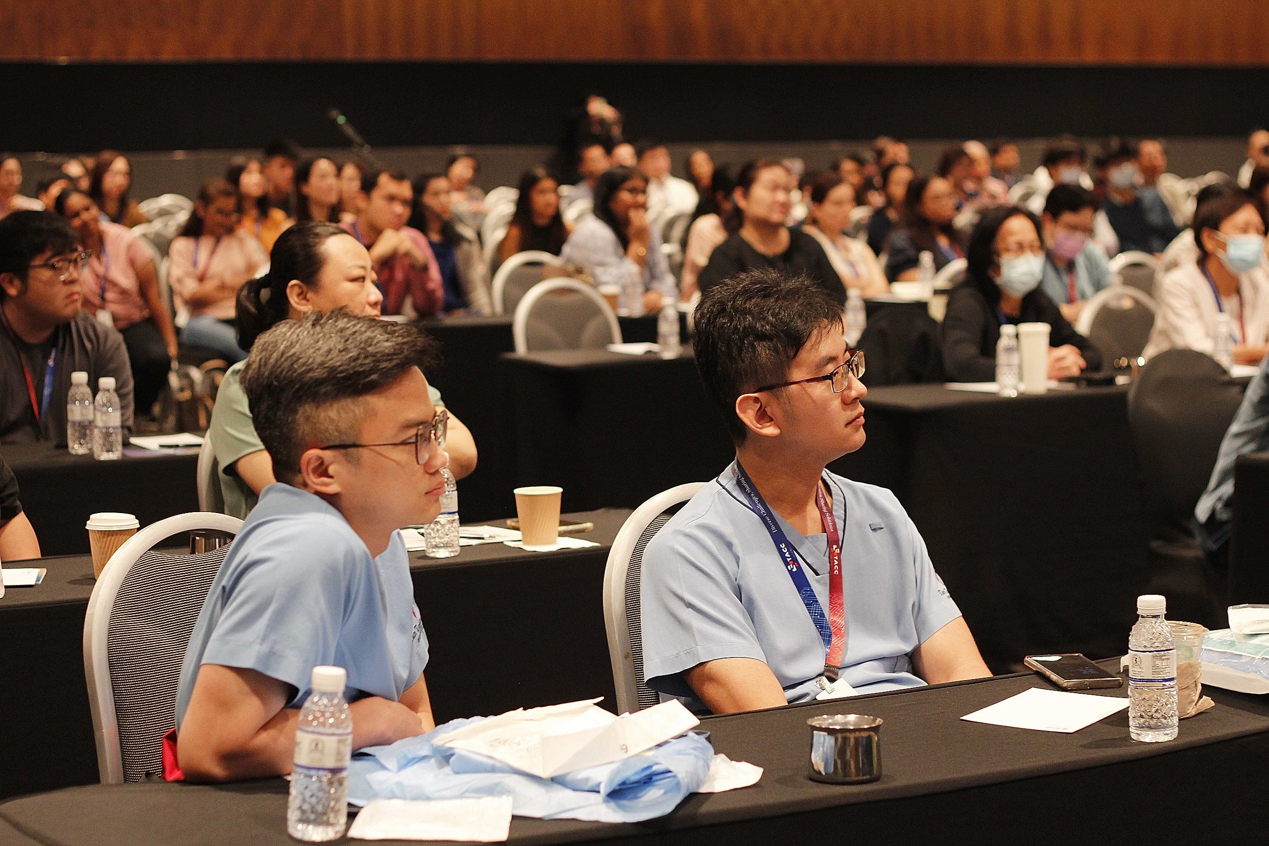 Participants listening to a talk at STACC 2023