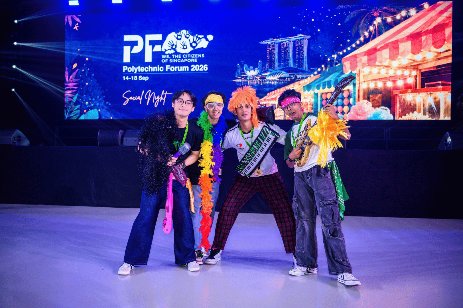 4 boys wearing wigs during the social night activity