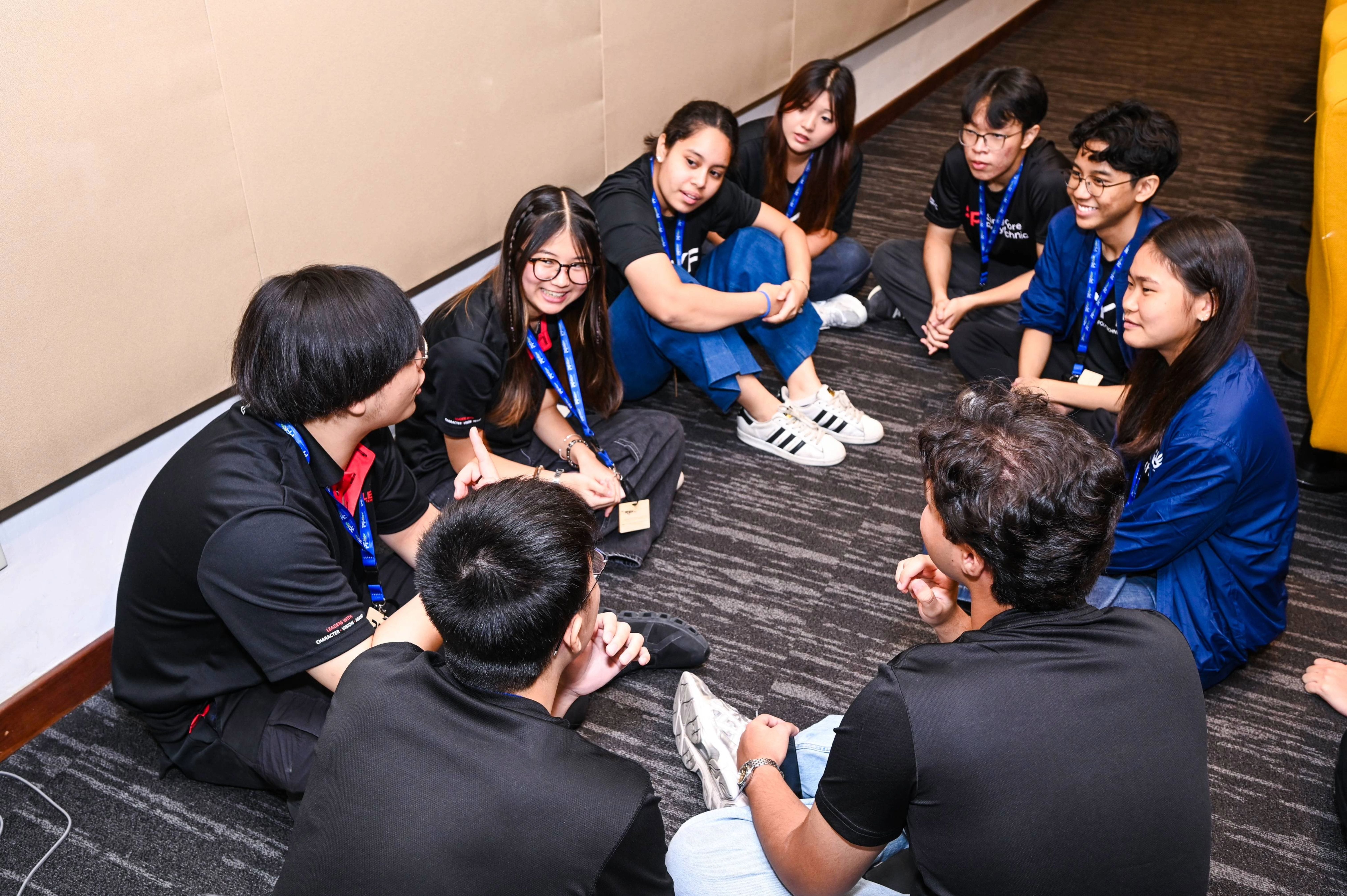 Student delegates engaging in their first sub-theme discussion, sharing perspectives and ideas in small groups.