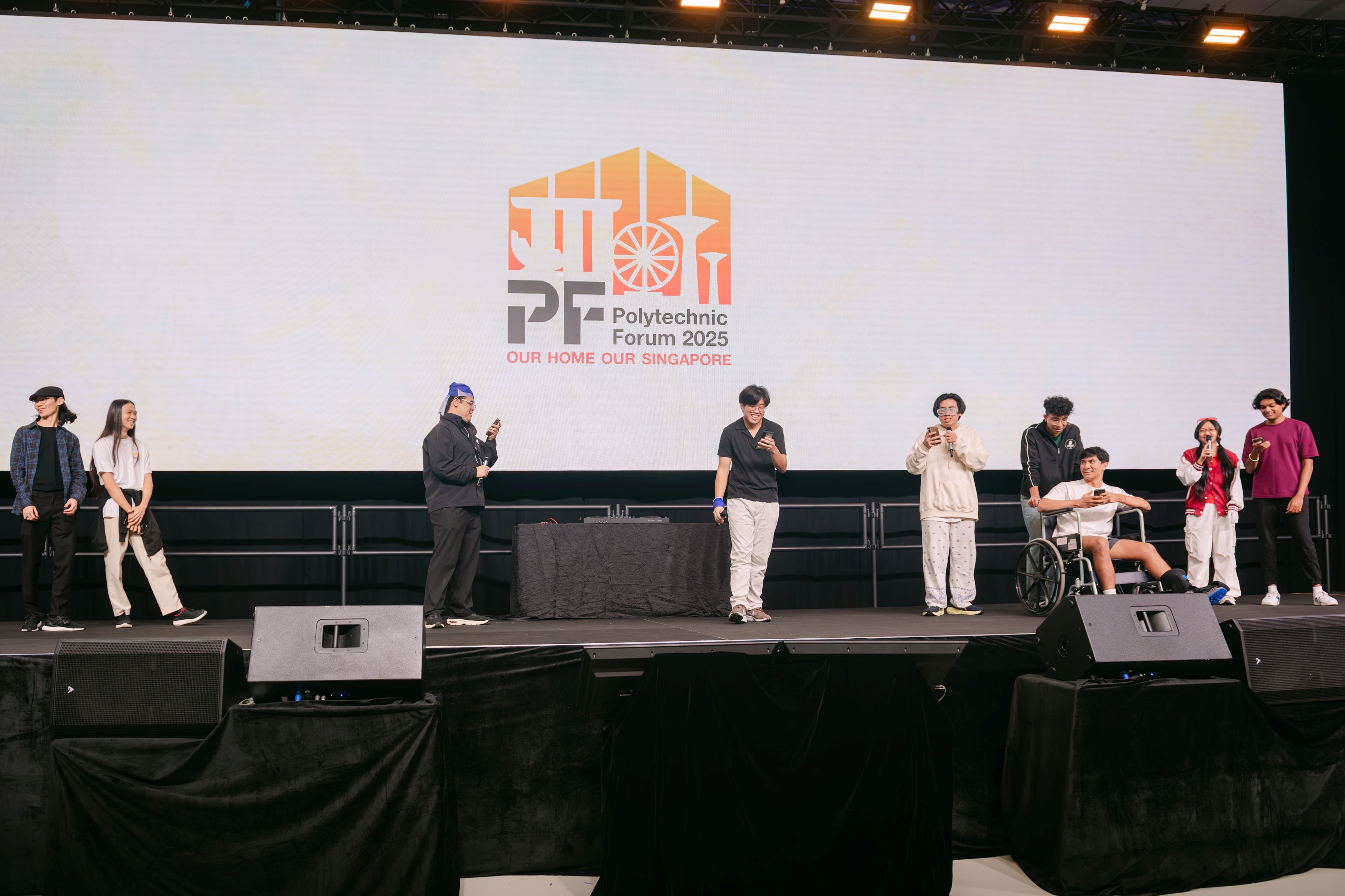 Several young people on a stage at Polytechnic Forum 2025 Our Home Our Singapore event, one seated in a wheelchair.