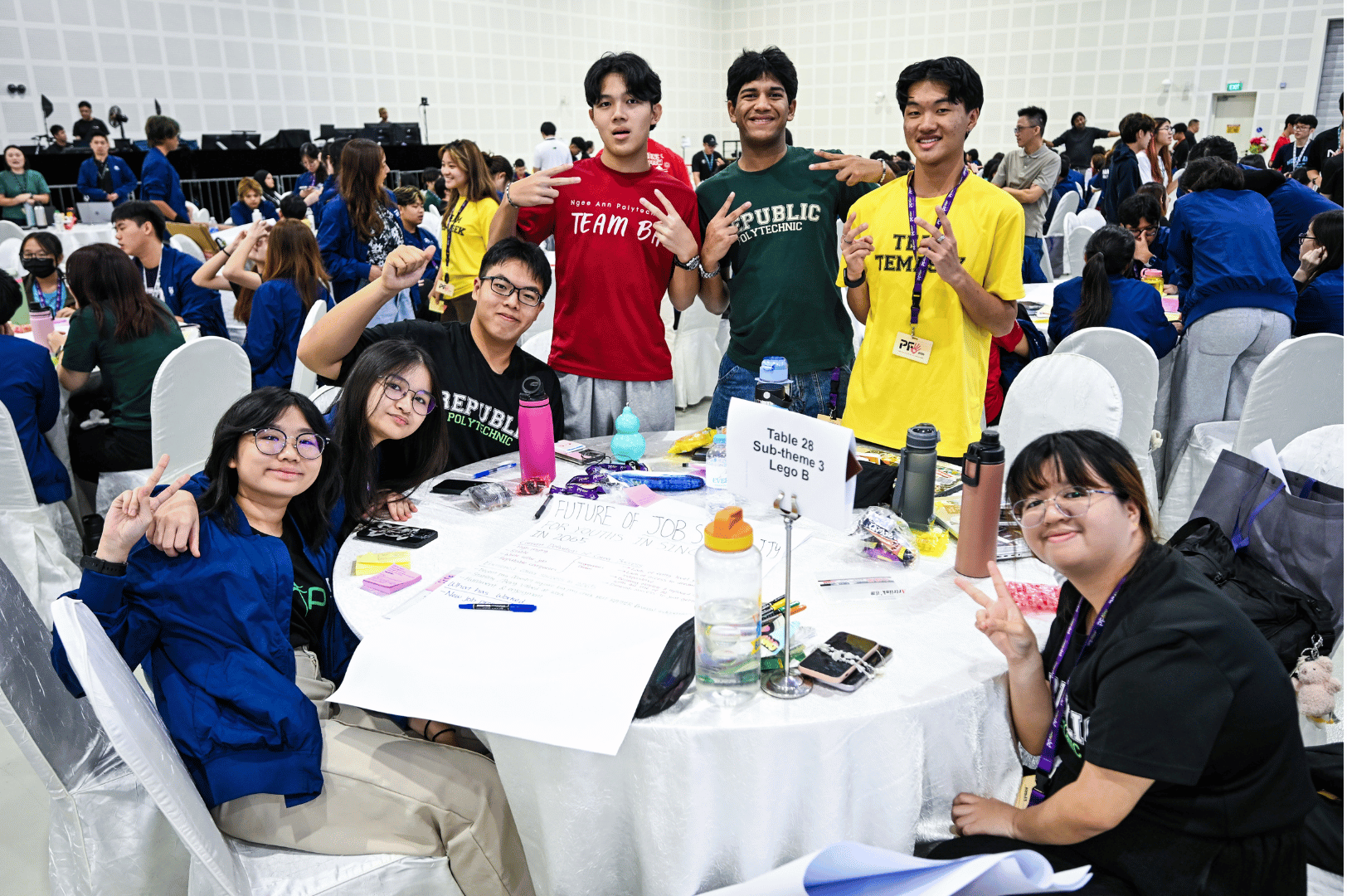 students posing with their end products for workshop