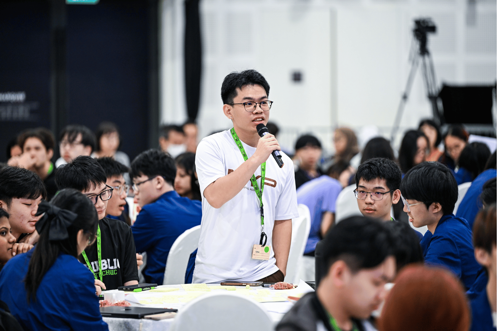 student speaking with a mic