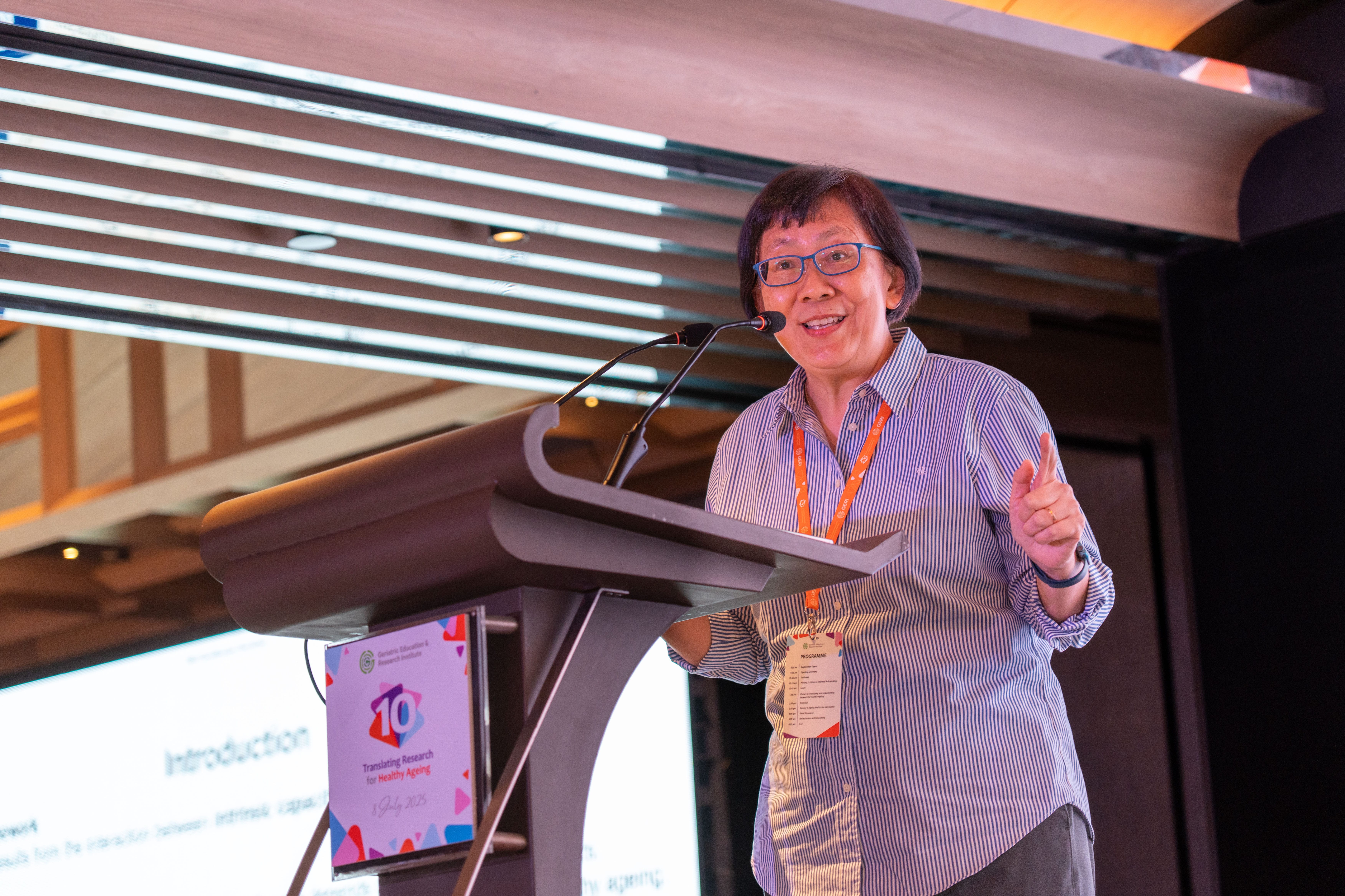 Woman giving a presentation on stage
