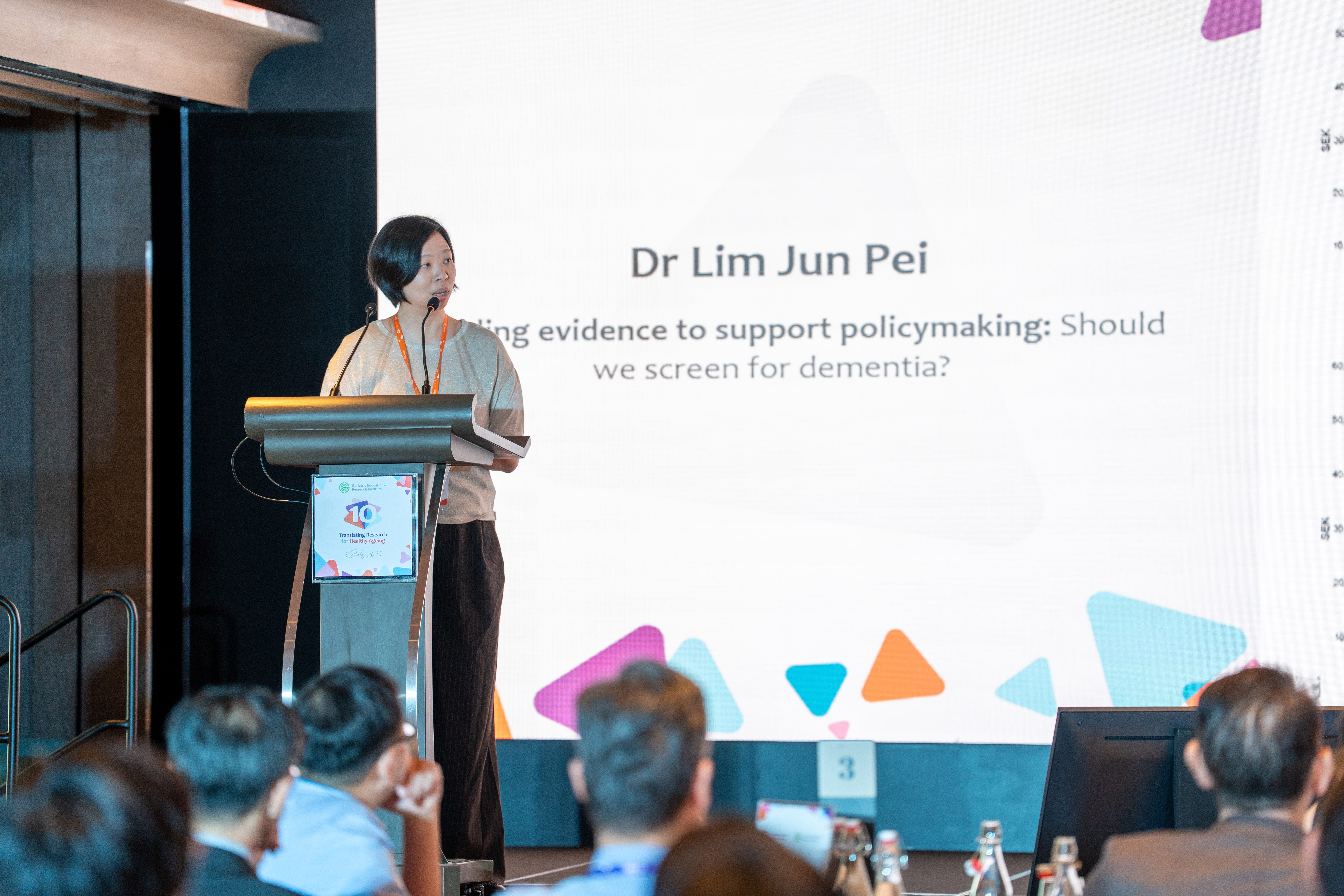 Woman giving a presentation on stage