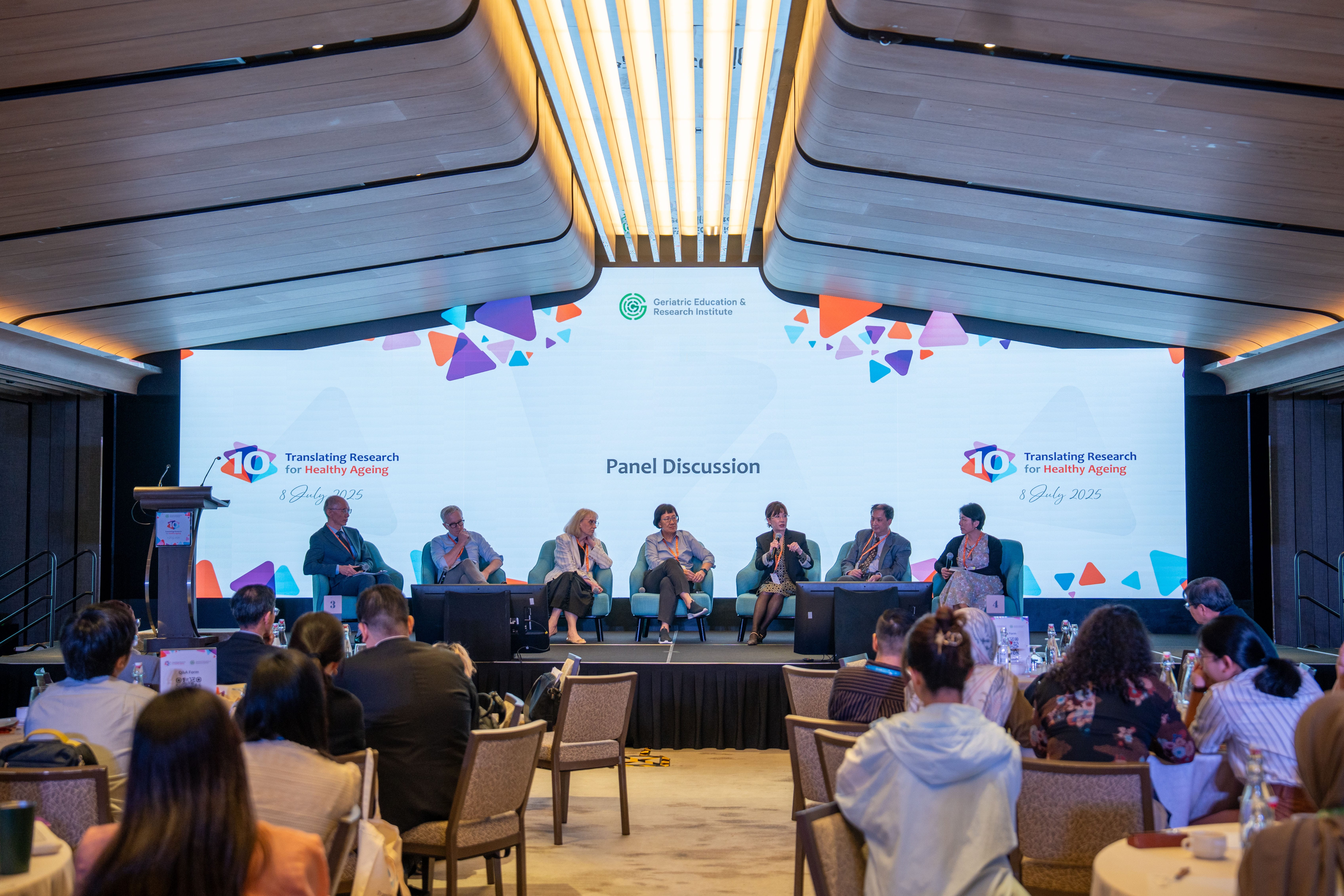 Panellists having a discussion on stage