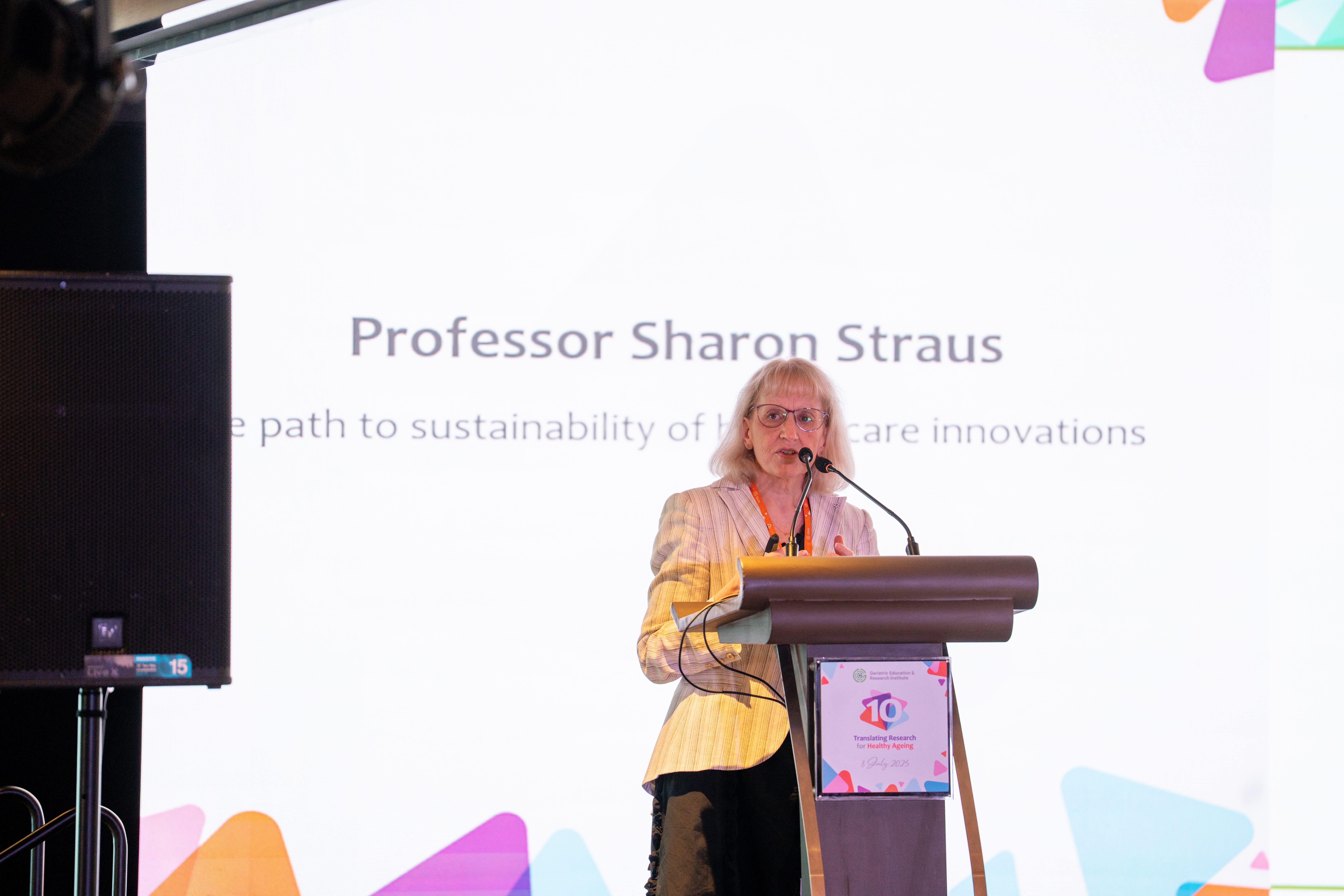 Woman giving a presentation on stage