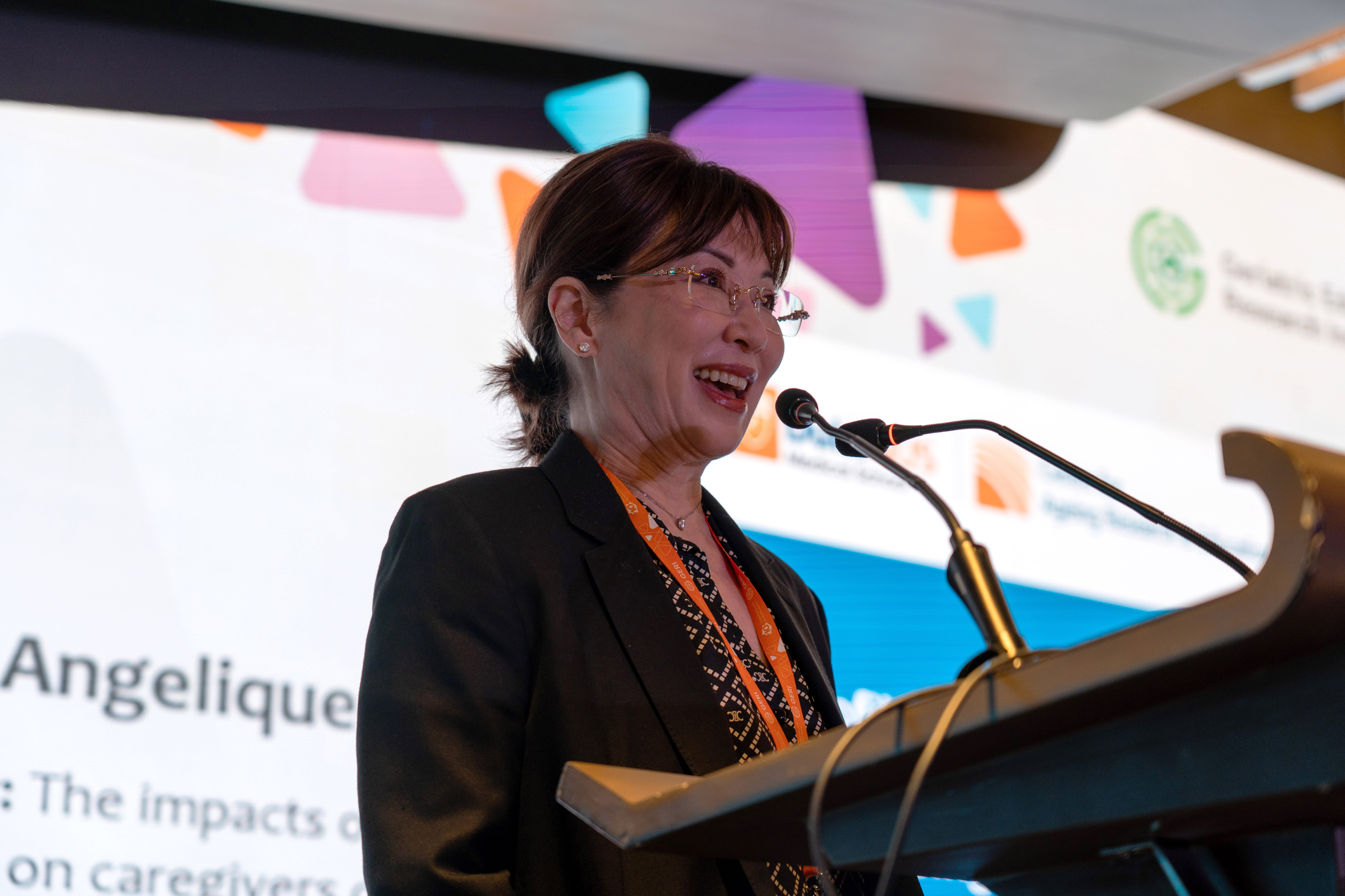 Woman giving a presentation on stage