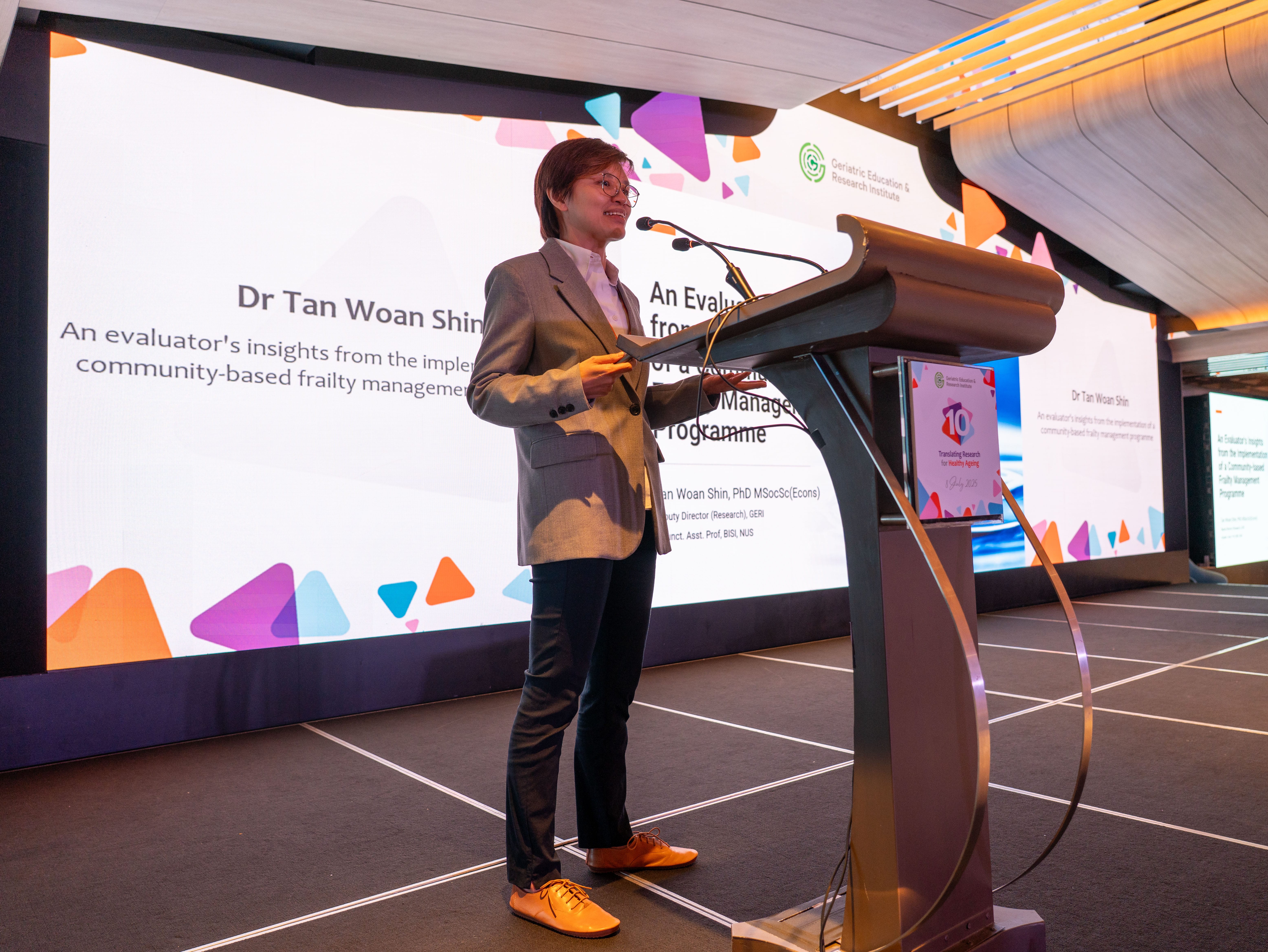 Woman giving a presentation on stage