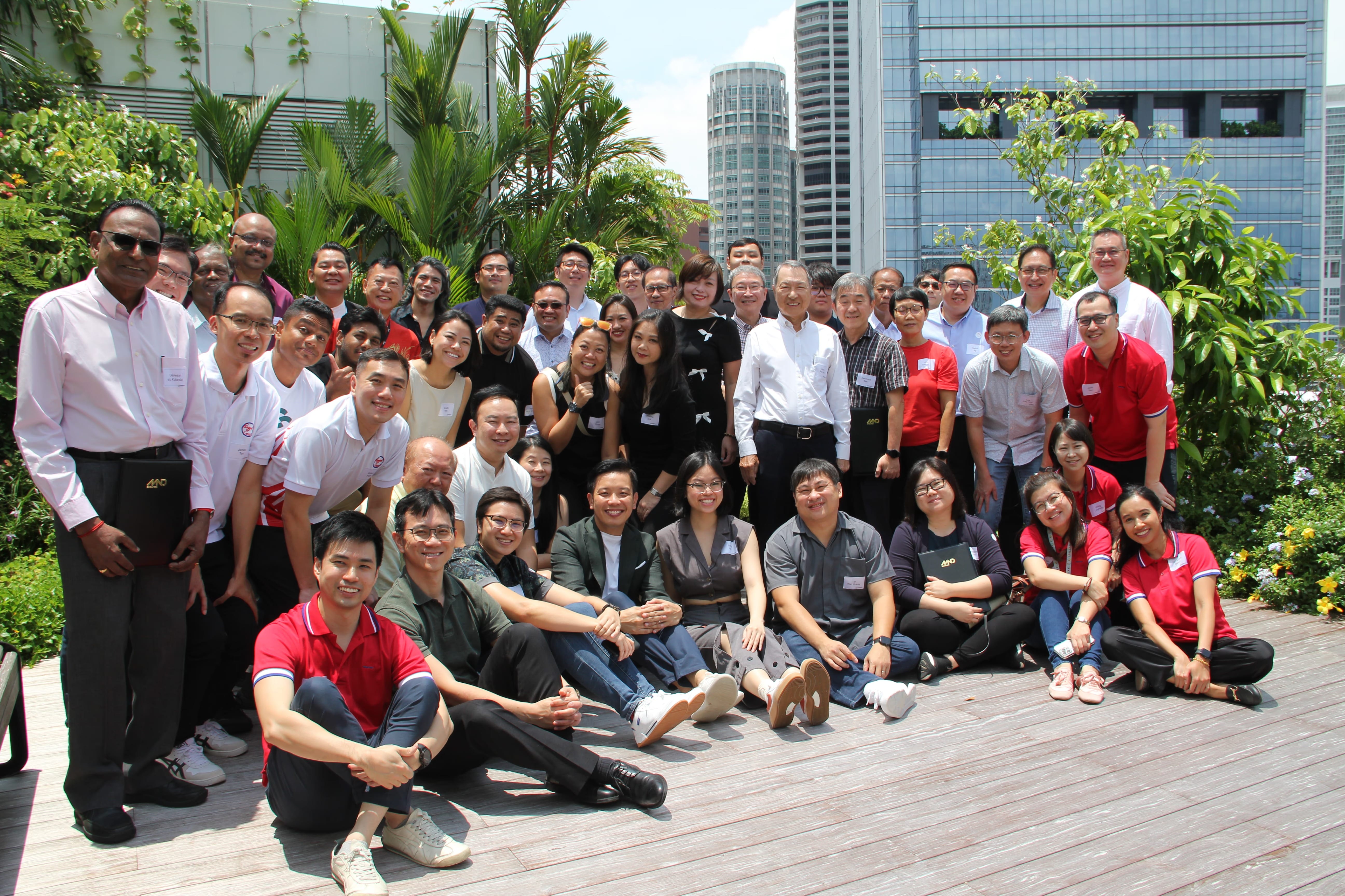Group photo of the OneService Kakis, MSO staff and MOS Alvin Tan (seated, front-centre).