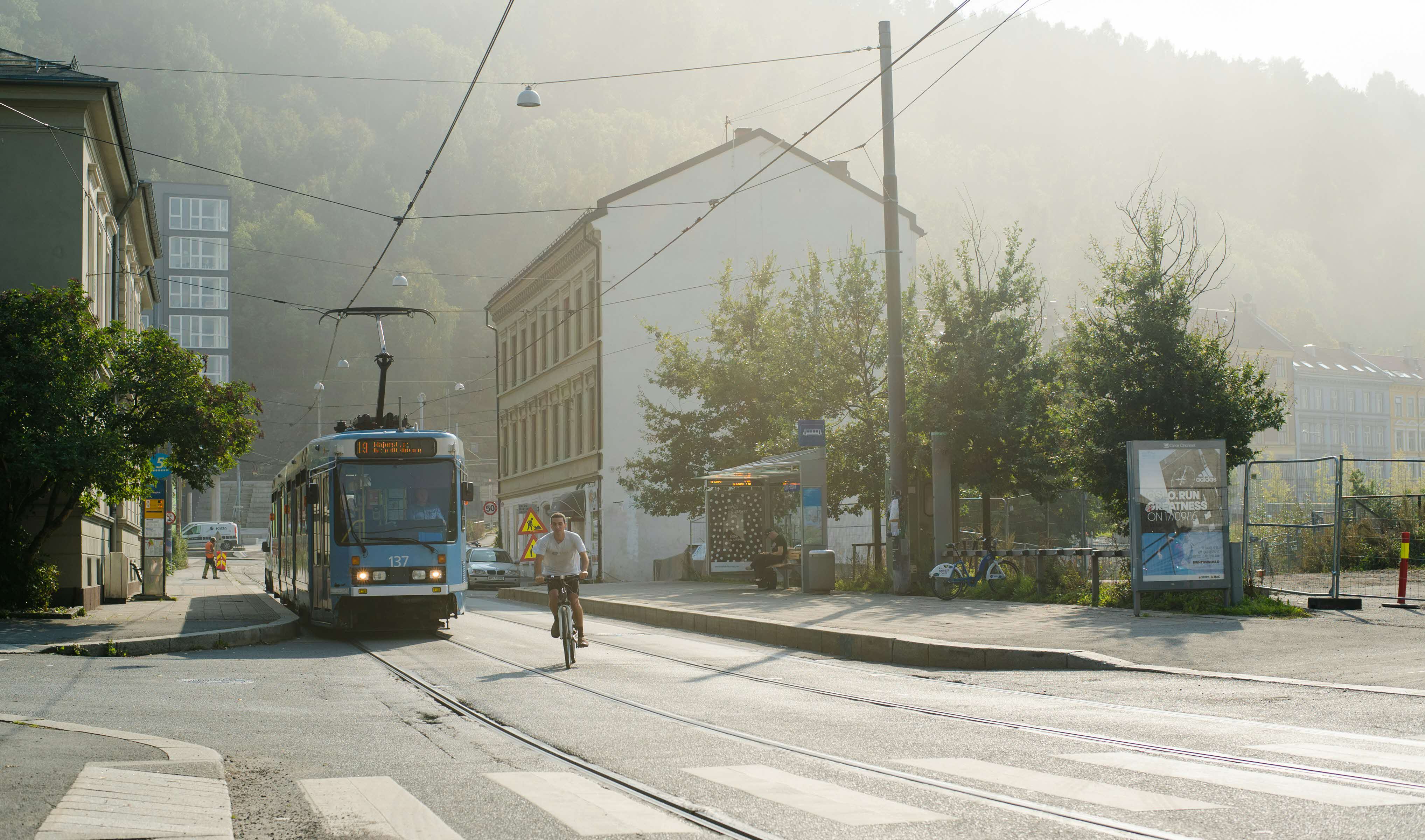 Photo of a cyclist and a tram in Oslo