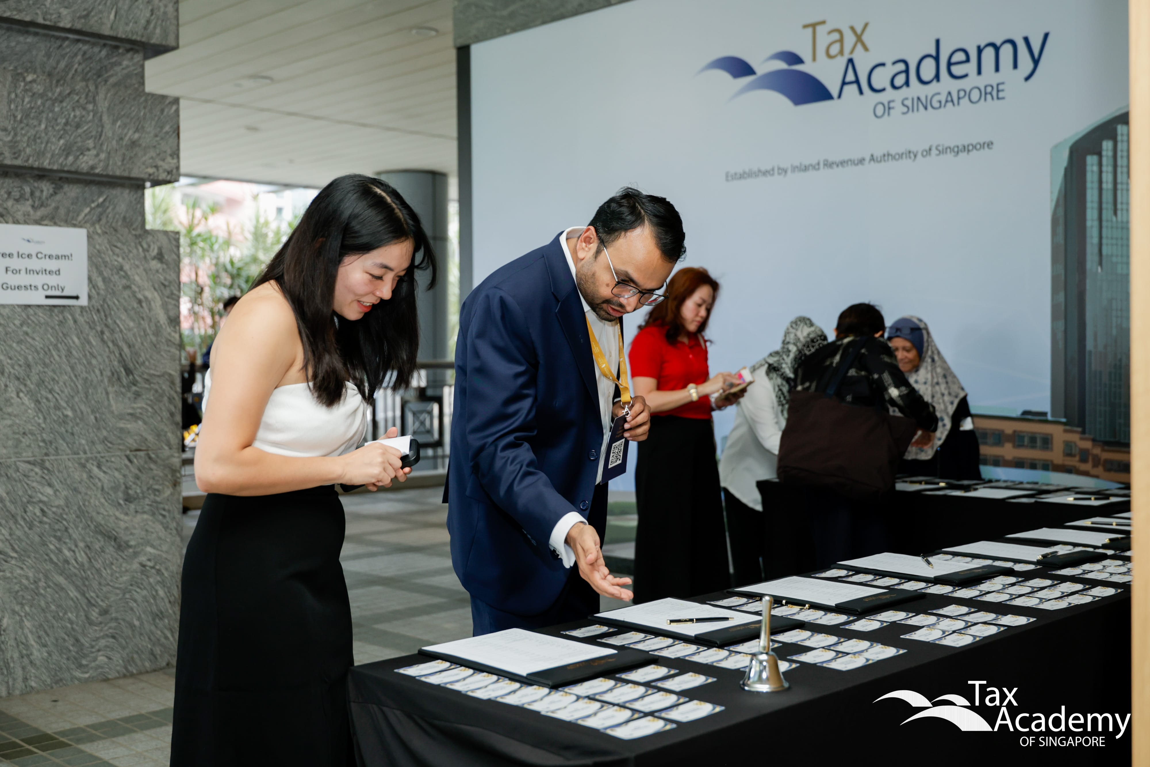 Ms Yvonne Loh ushering Mr Falgun Thakkar at the Opening of Tax Academy of Singapore Hub