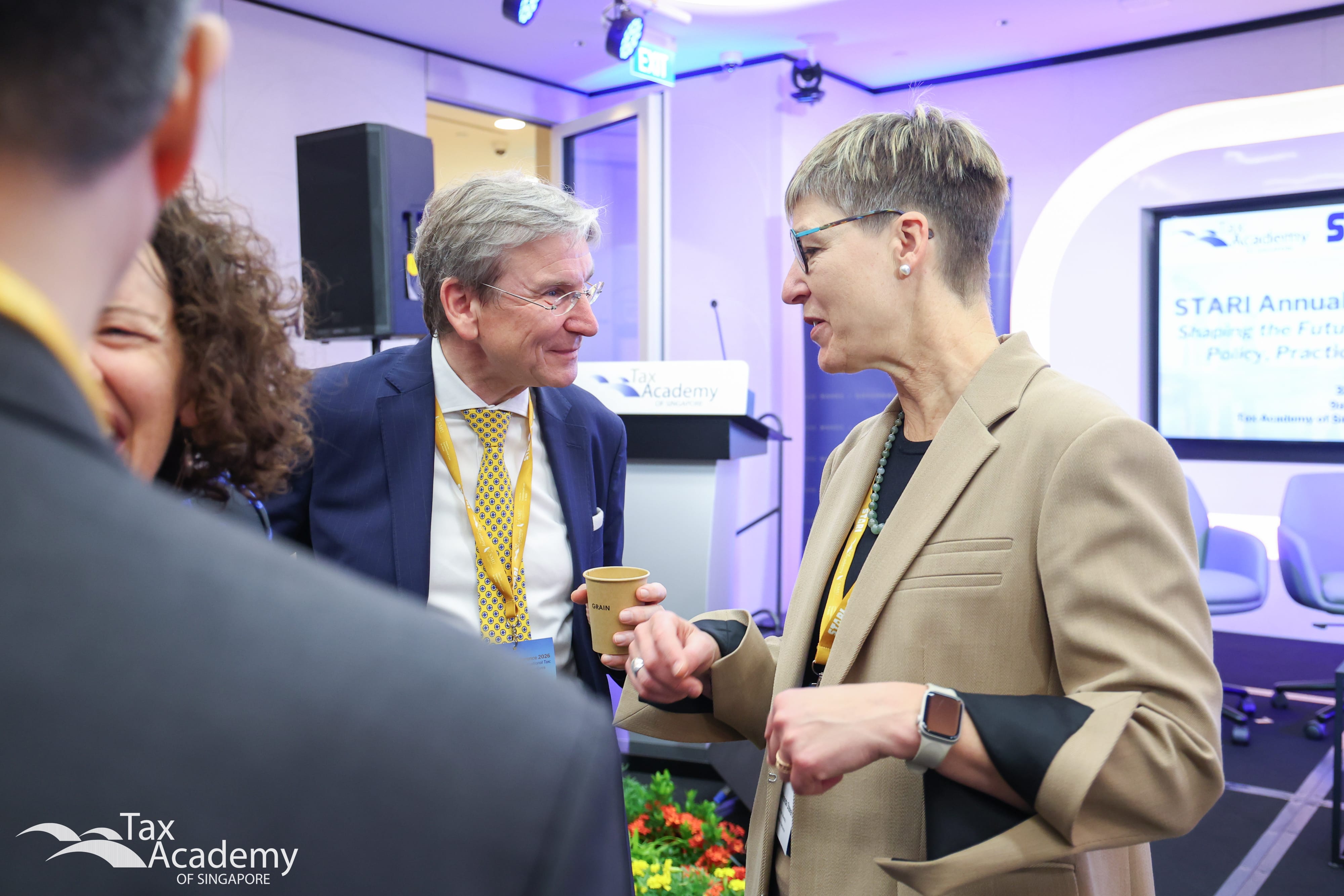 Professor Martin Wenz having a conversation with Professor Miranda Stewart