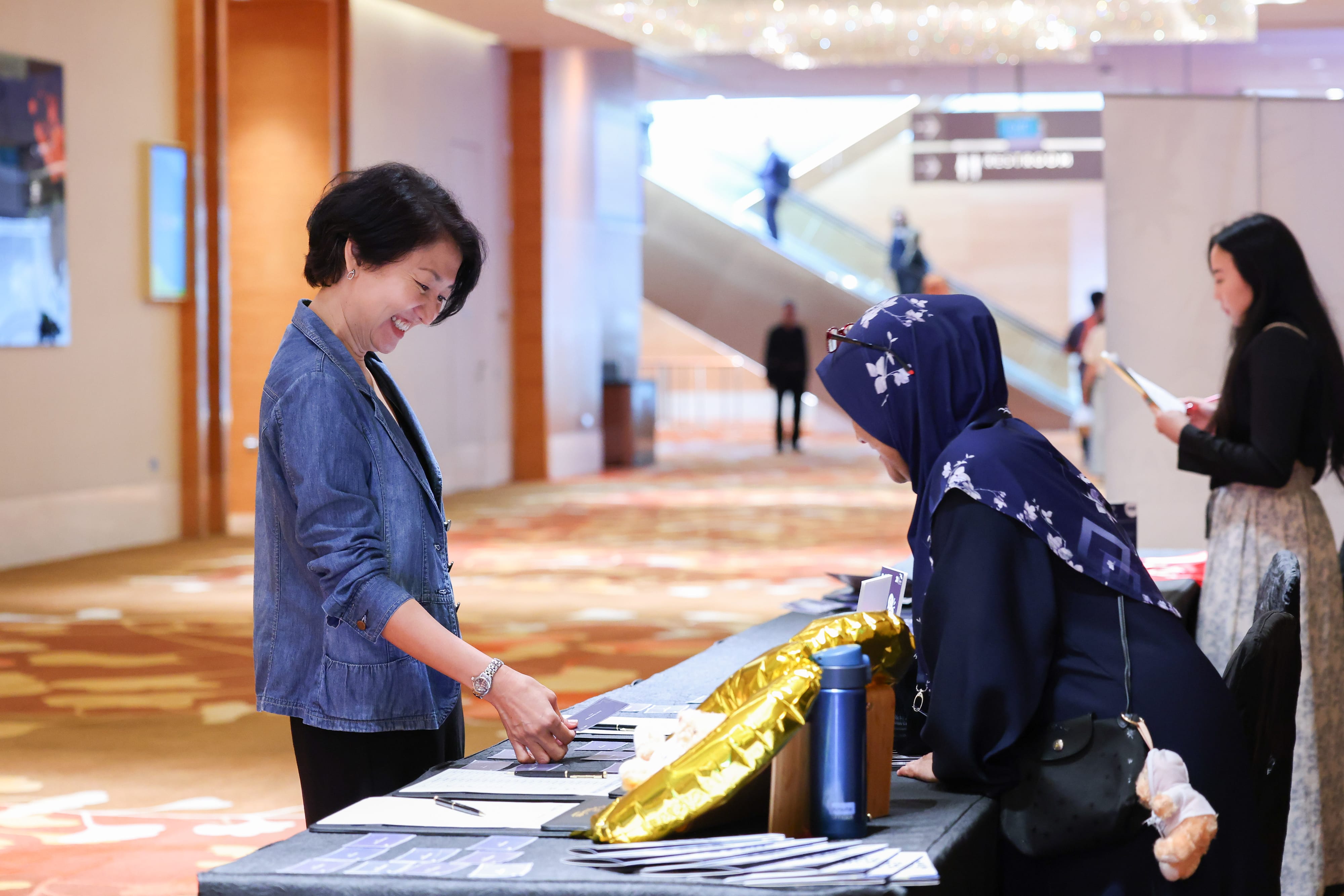Welcoming delegates as they arrive for Tax Academy's 20th Anniversary Conference