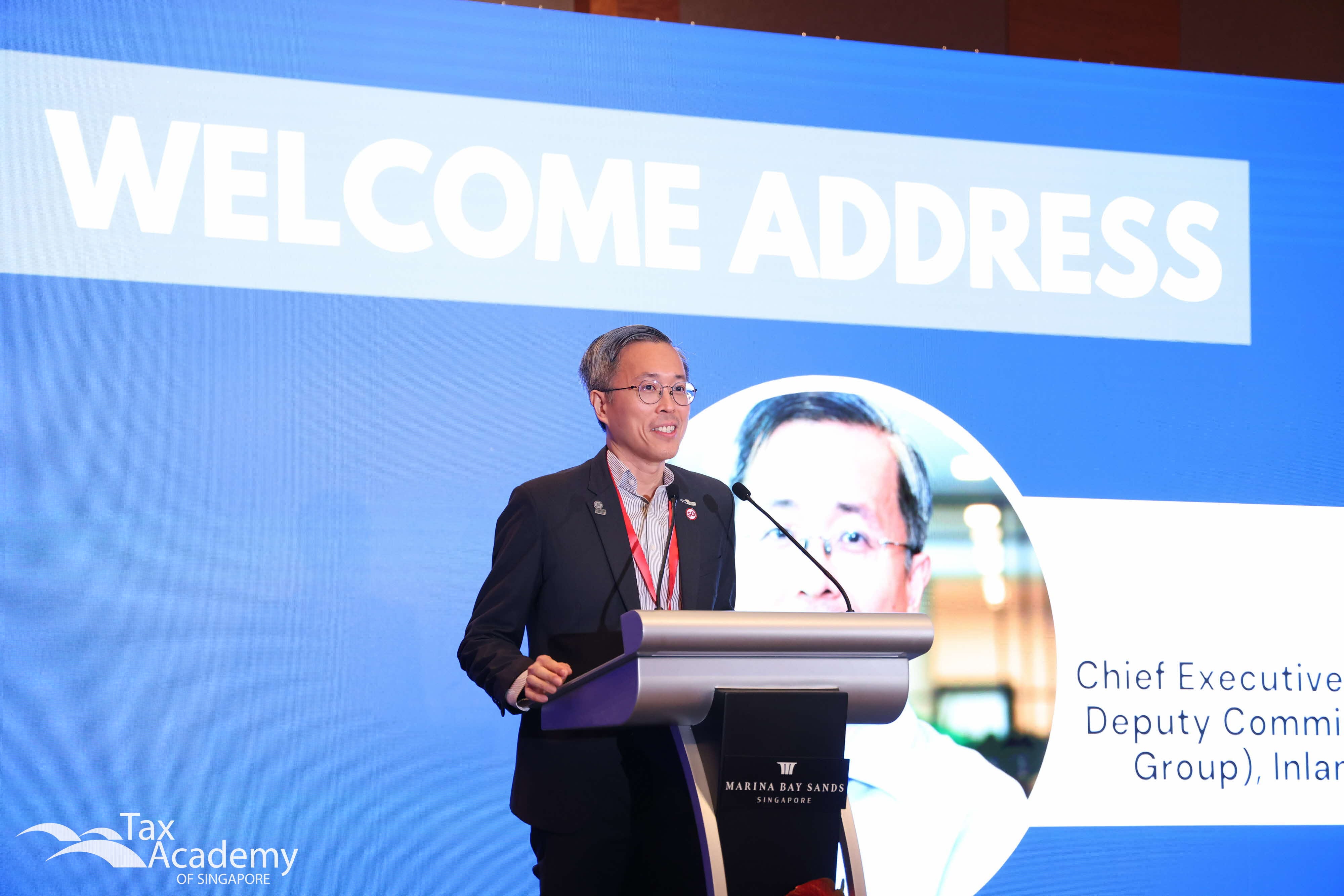 Tax Academy's CEO, Mr Dennis Lui, giving the opening address at the 20th Anniversary Conference
