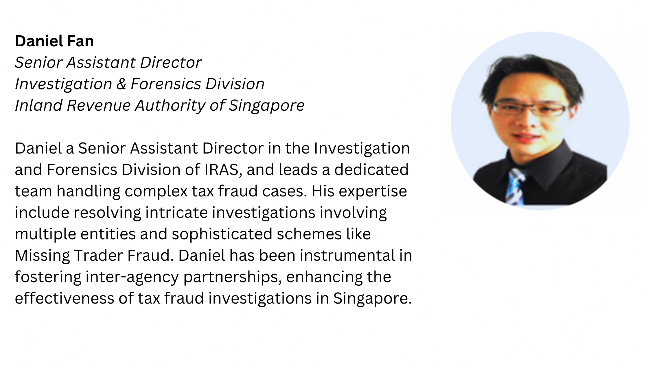 Daniel Fan, Senior Assistant Director at IRAS, wearing glasses and a dark suit with a blue tie.