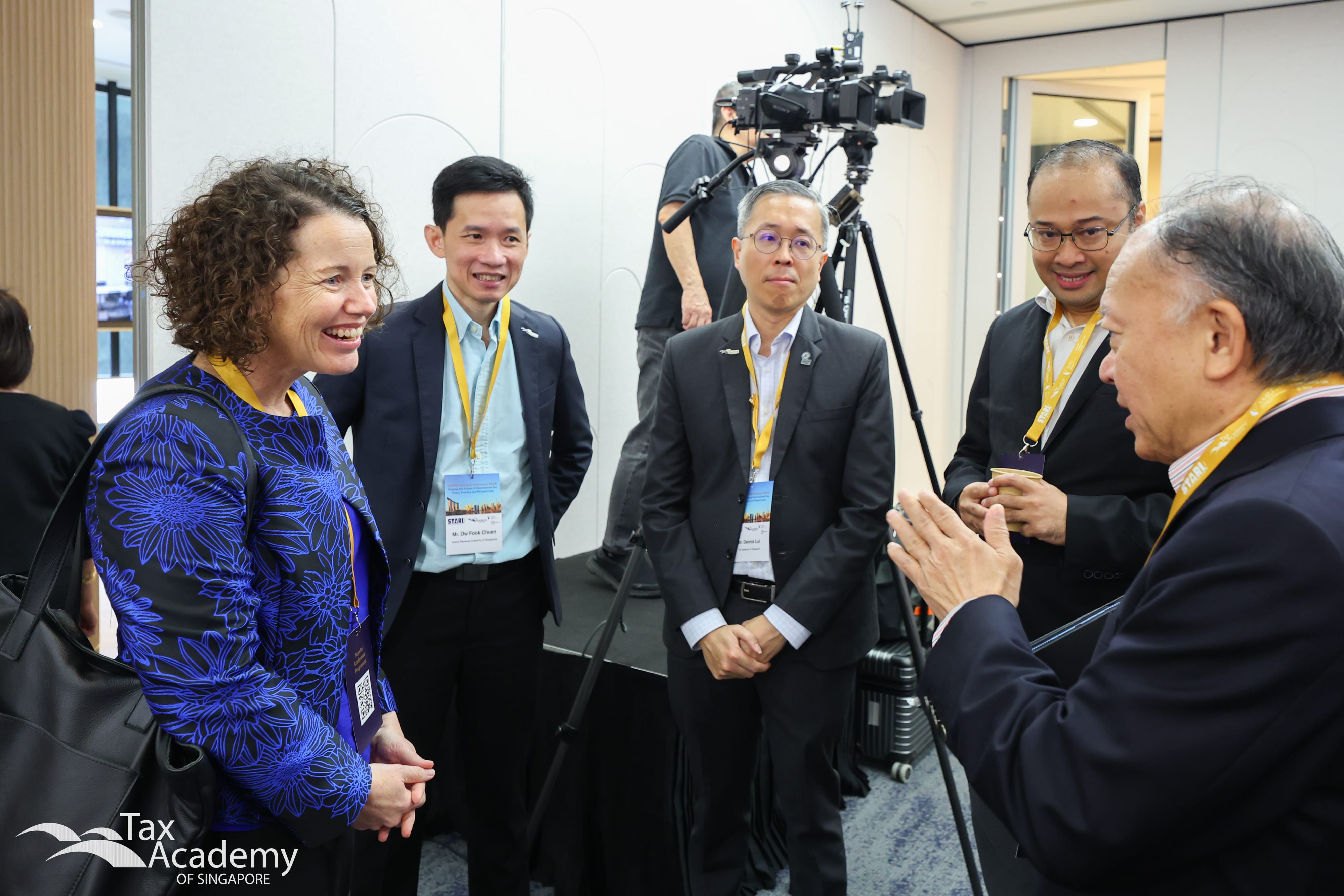 Chairman of Tax Academy, Mr Tham Sai Choy, speaking to Australian Deputy High Commissioner to Singapore, Ms Emily Follett