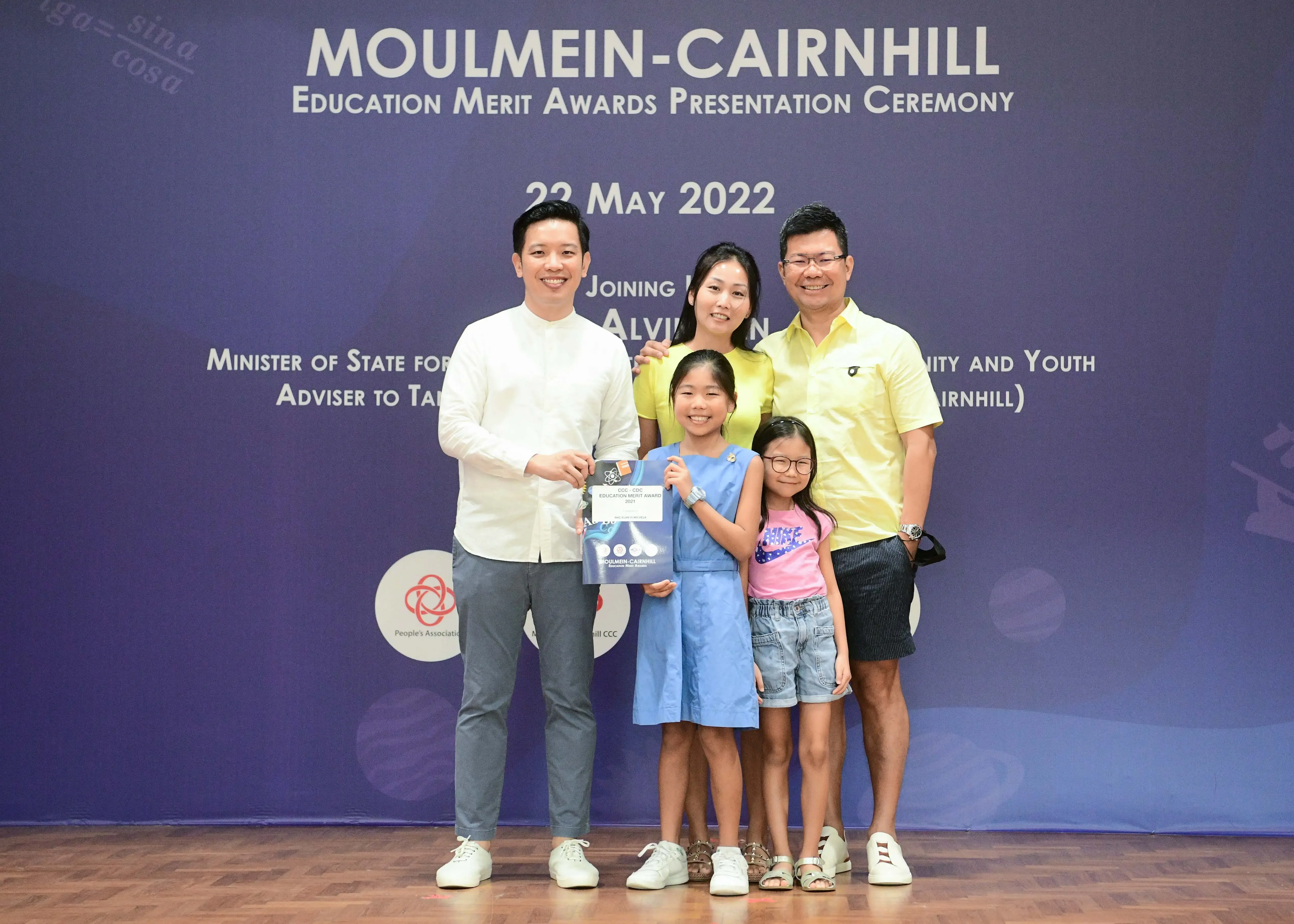 Five people pose at the Moulmein-Cairnhill Education Merit Awards Presentation Ceremony on 22 May 2022.