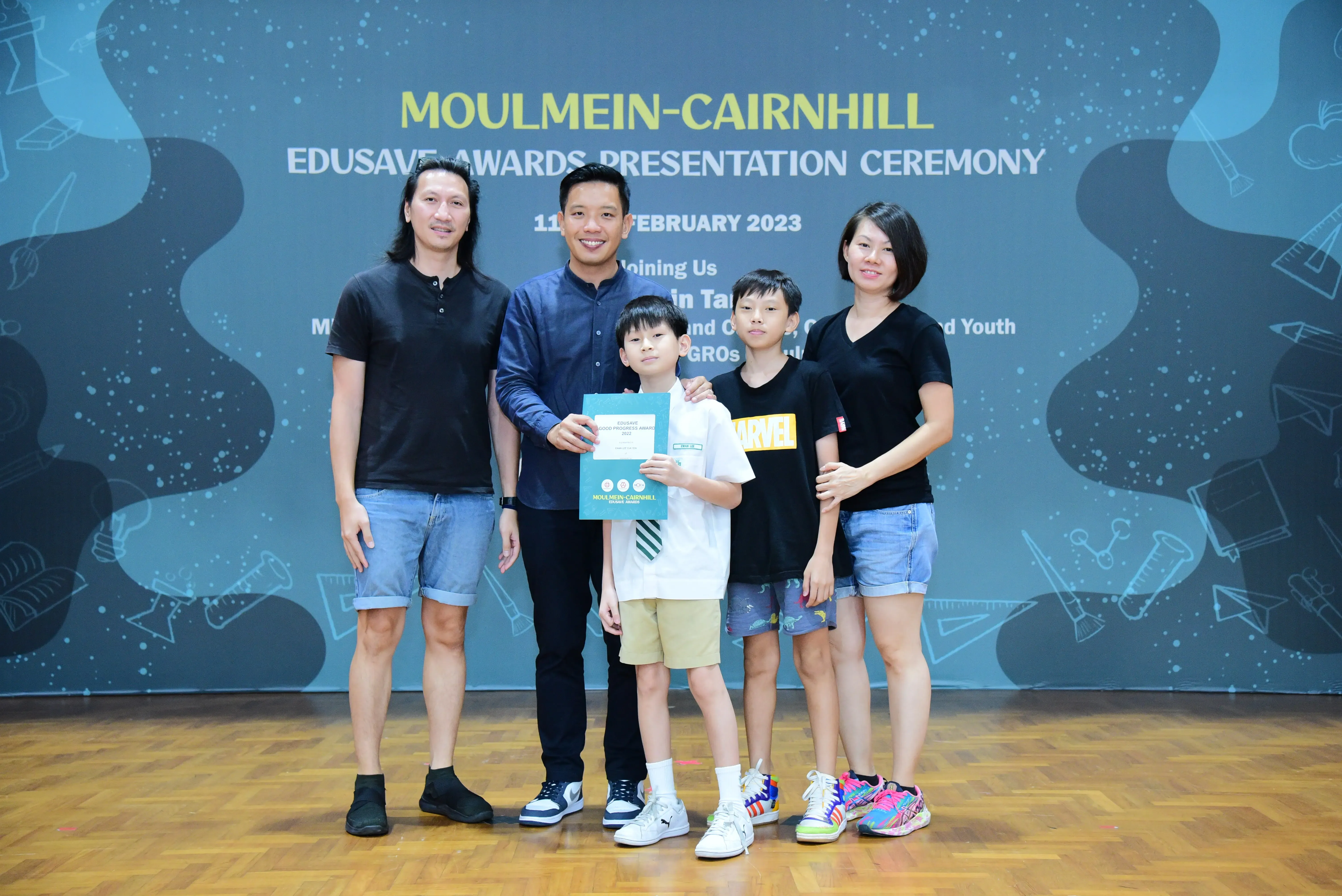 Five people pose with award certificates at the Moulmein-Cairnhill Edusave Awards Presentation Ceremony, February 2023.