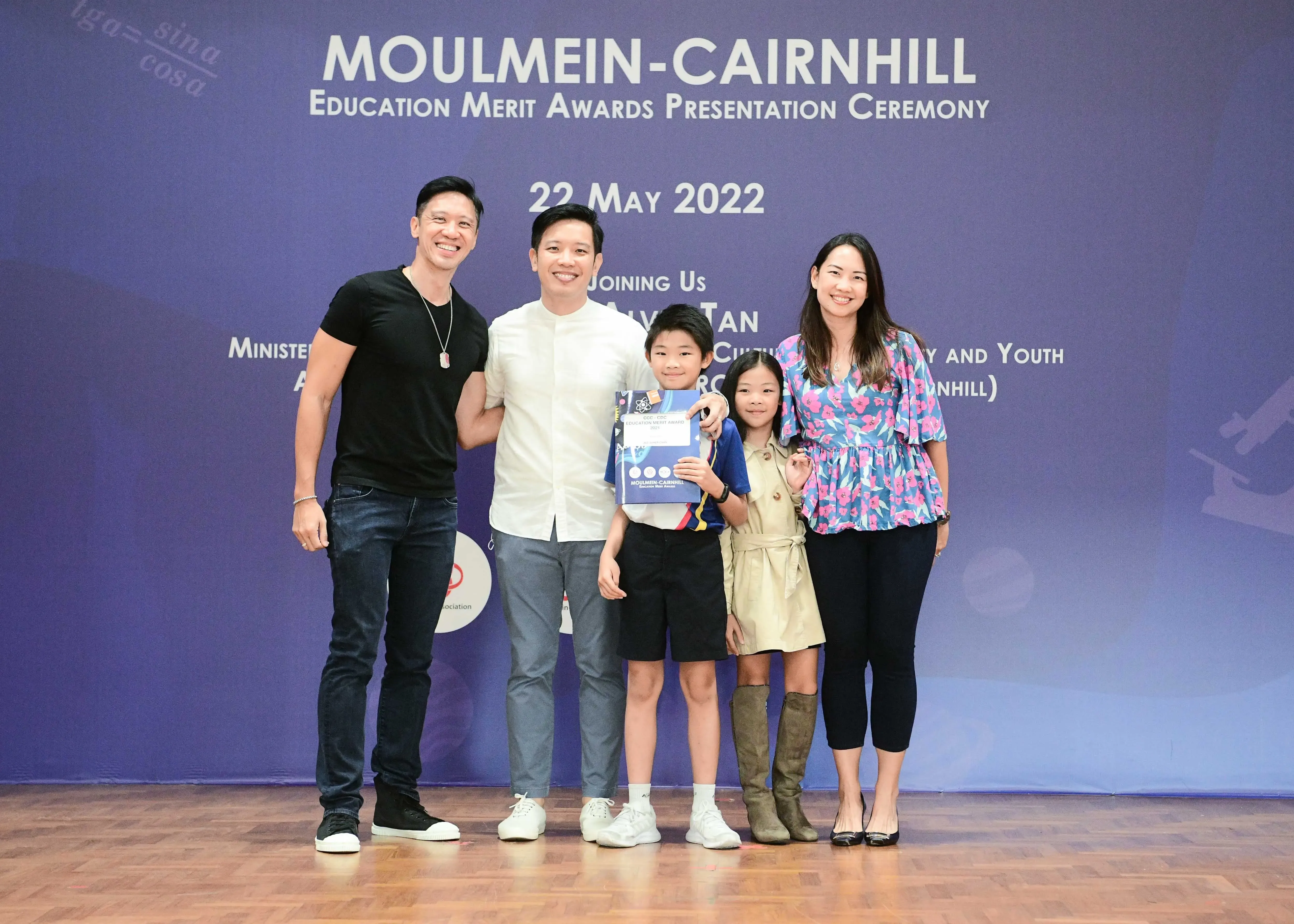 Five people pose at the Moulmein-Cairnhill Education Merit Awards Presentation Ceremony on 22 May 2022.