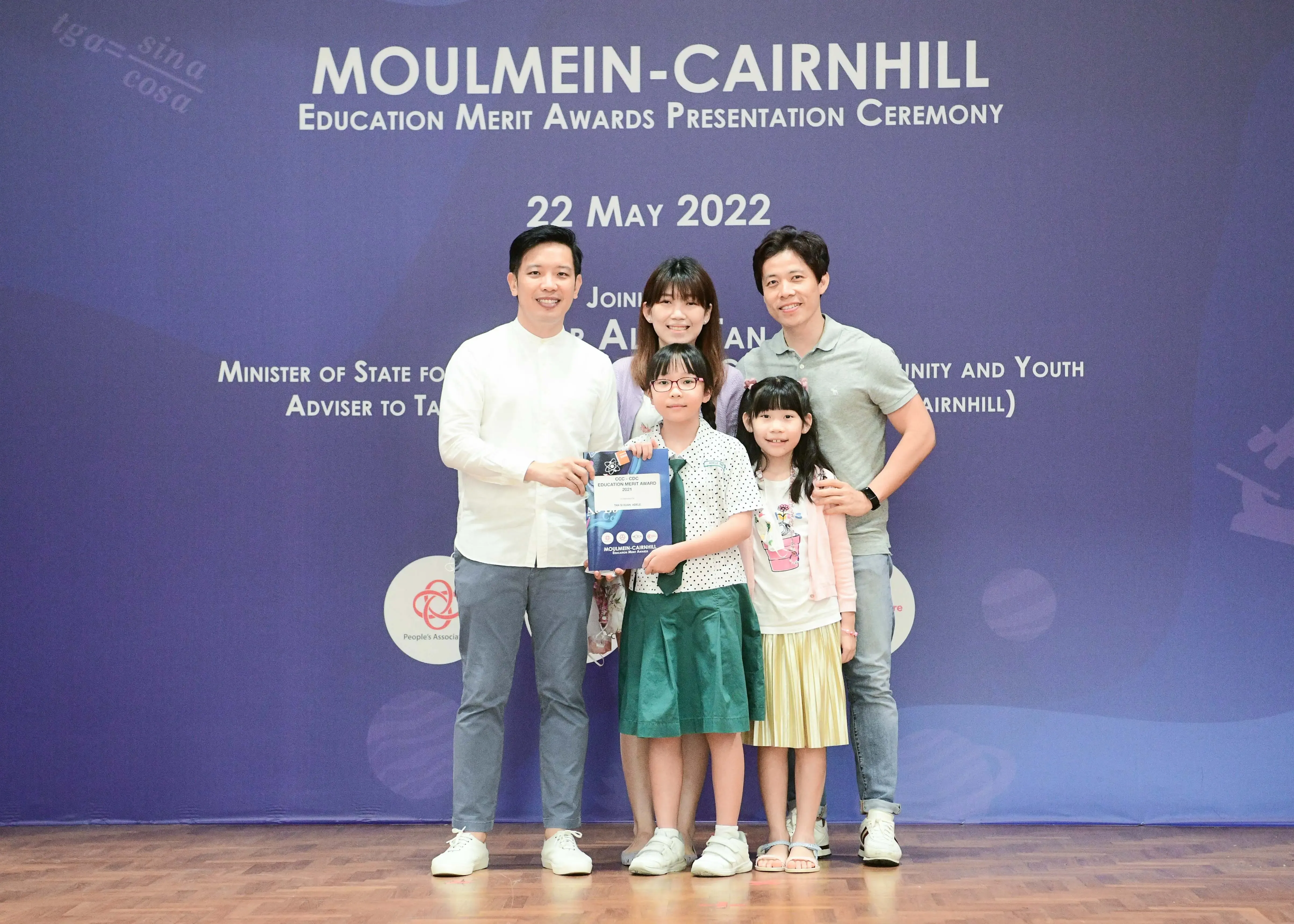 Five people pose at the Moulmein-Cairnhill Education Merit Awards Presentation Ceremony on 22 May 2022.