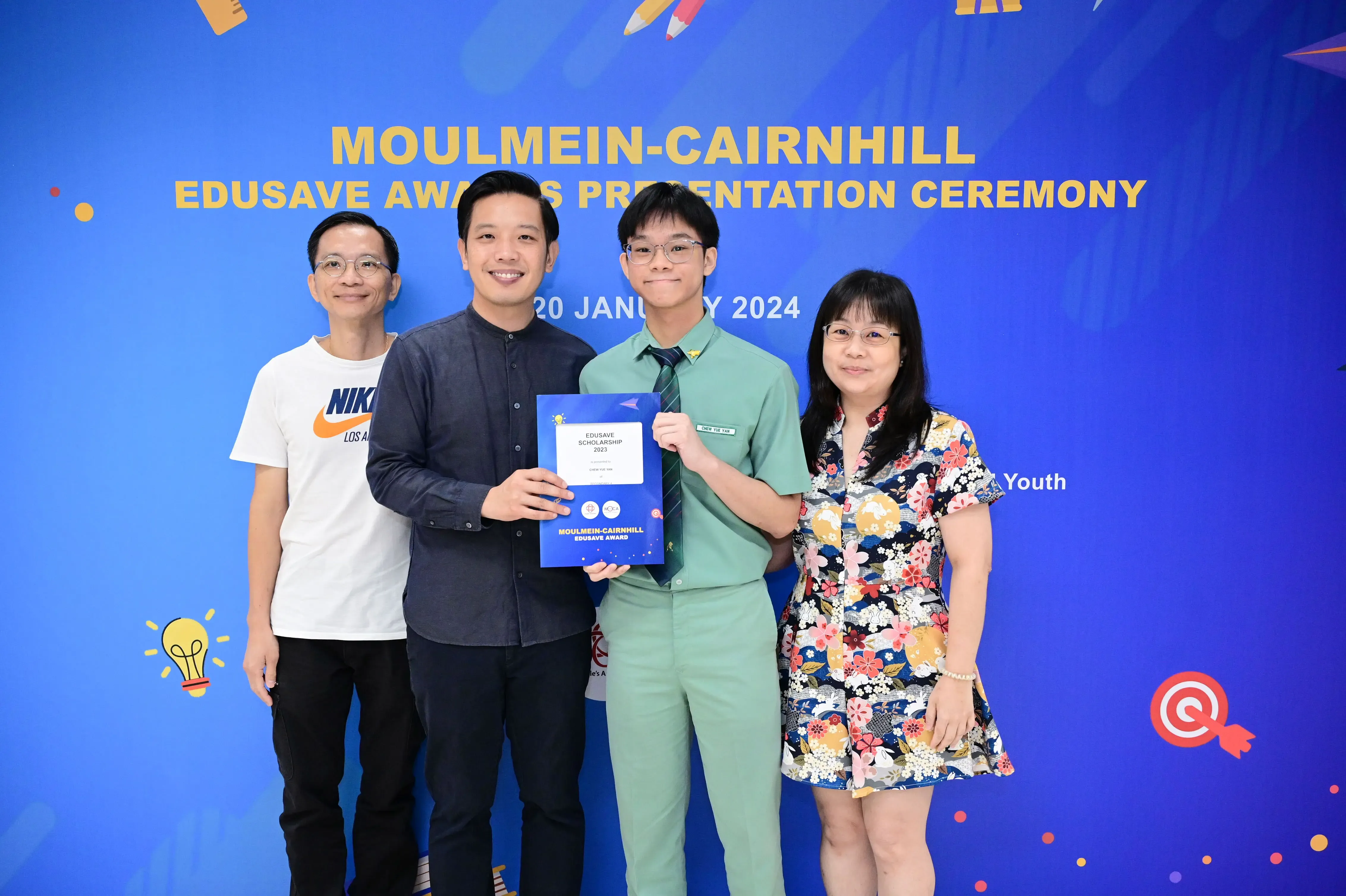 Four people pose at the Moulmein-Cairnhill Edusave Awards Presentation Ceremony on 20 January 2024.