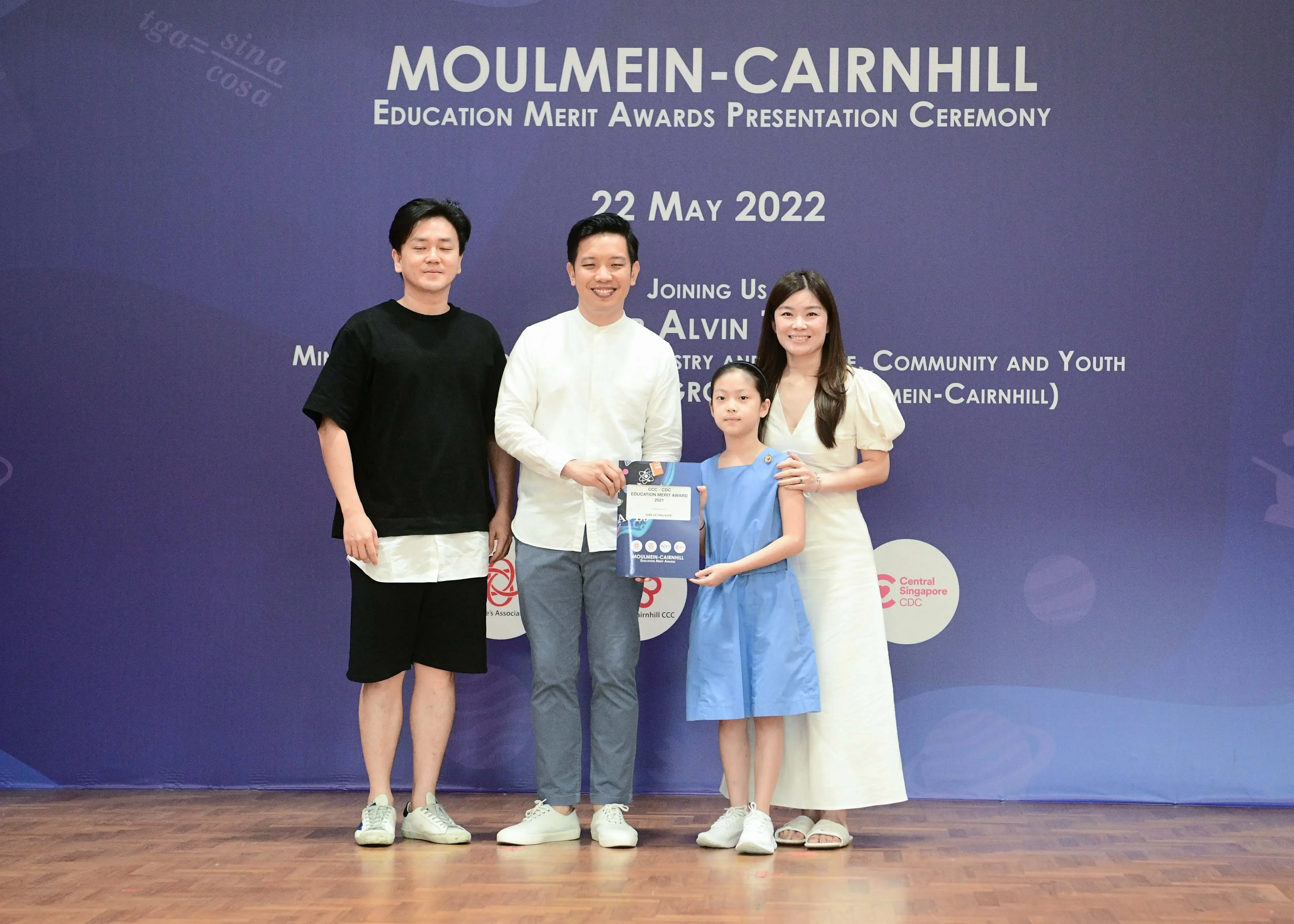 Four people pose at the Moulmein-Cairnhill Education Merit Awards Presentation Ceremony on 22 May 2022.
