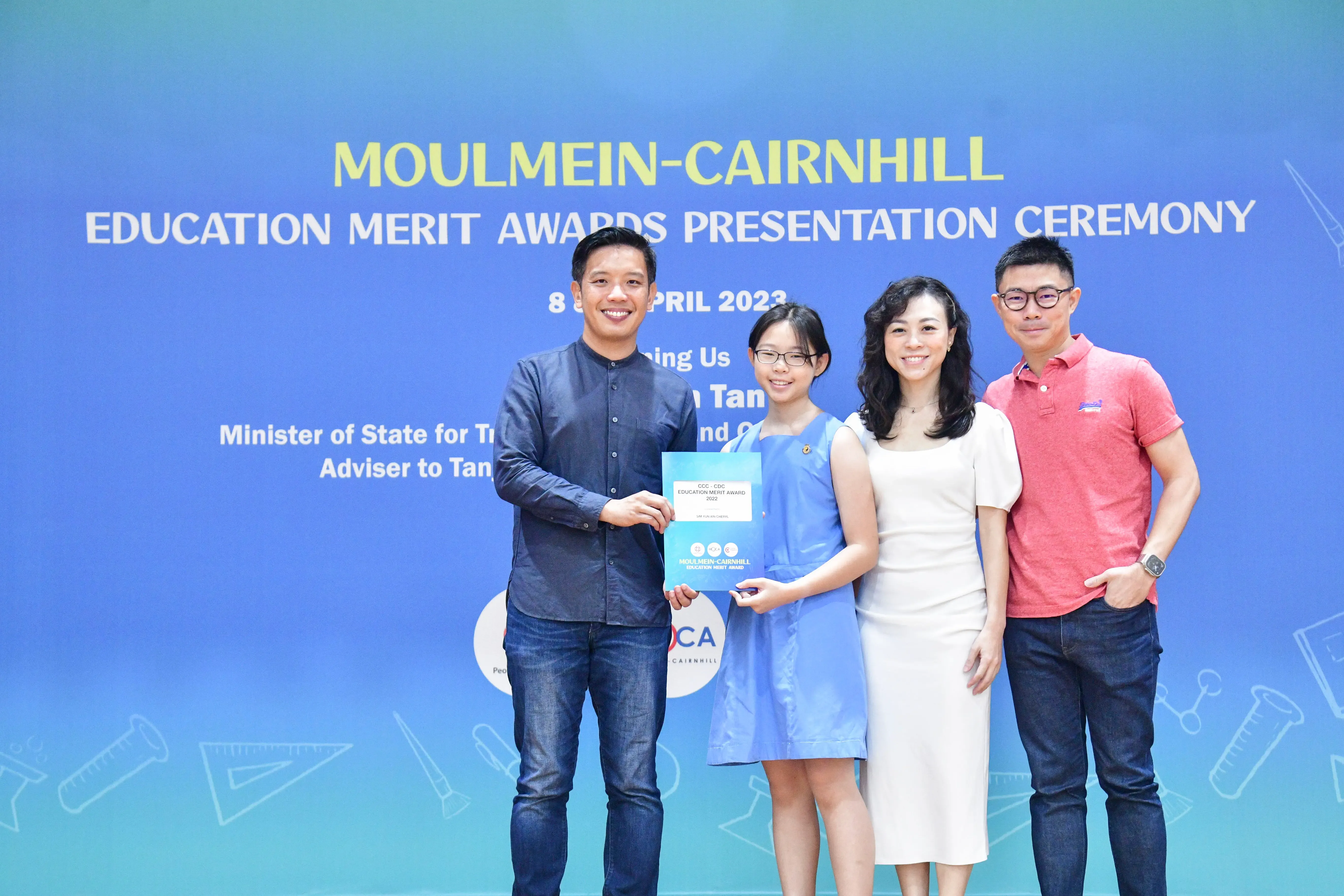 Four people pose at the Moulmein-Cairnhill Education Merit Awards Presentation Ceremony, April 2023.