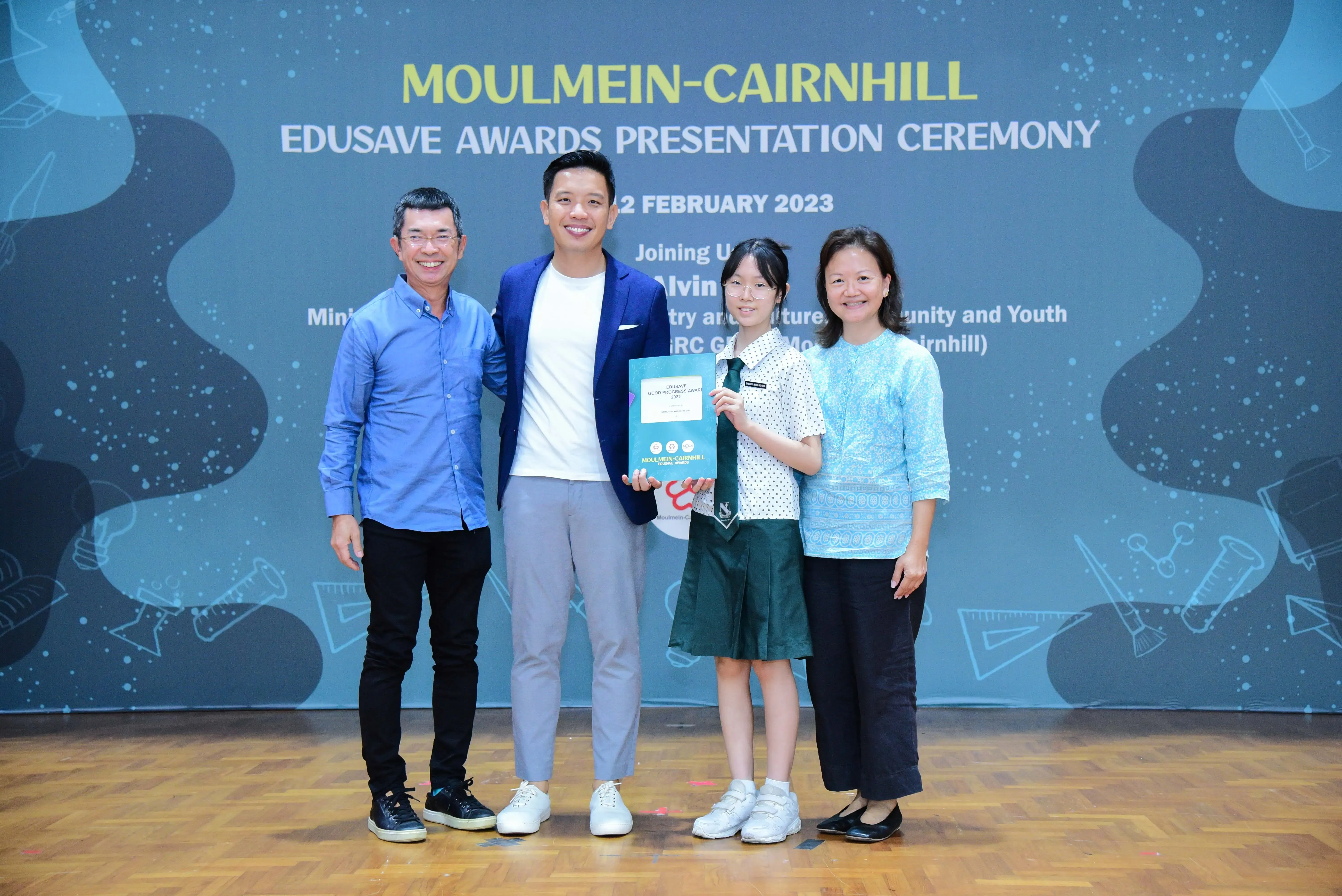 Four people pose at the Moulmein-Cairnhill Edusave Awards Presentation Ceremony on 2 February 2023.