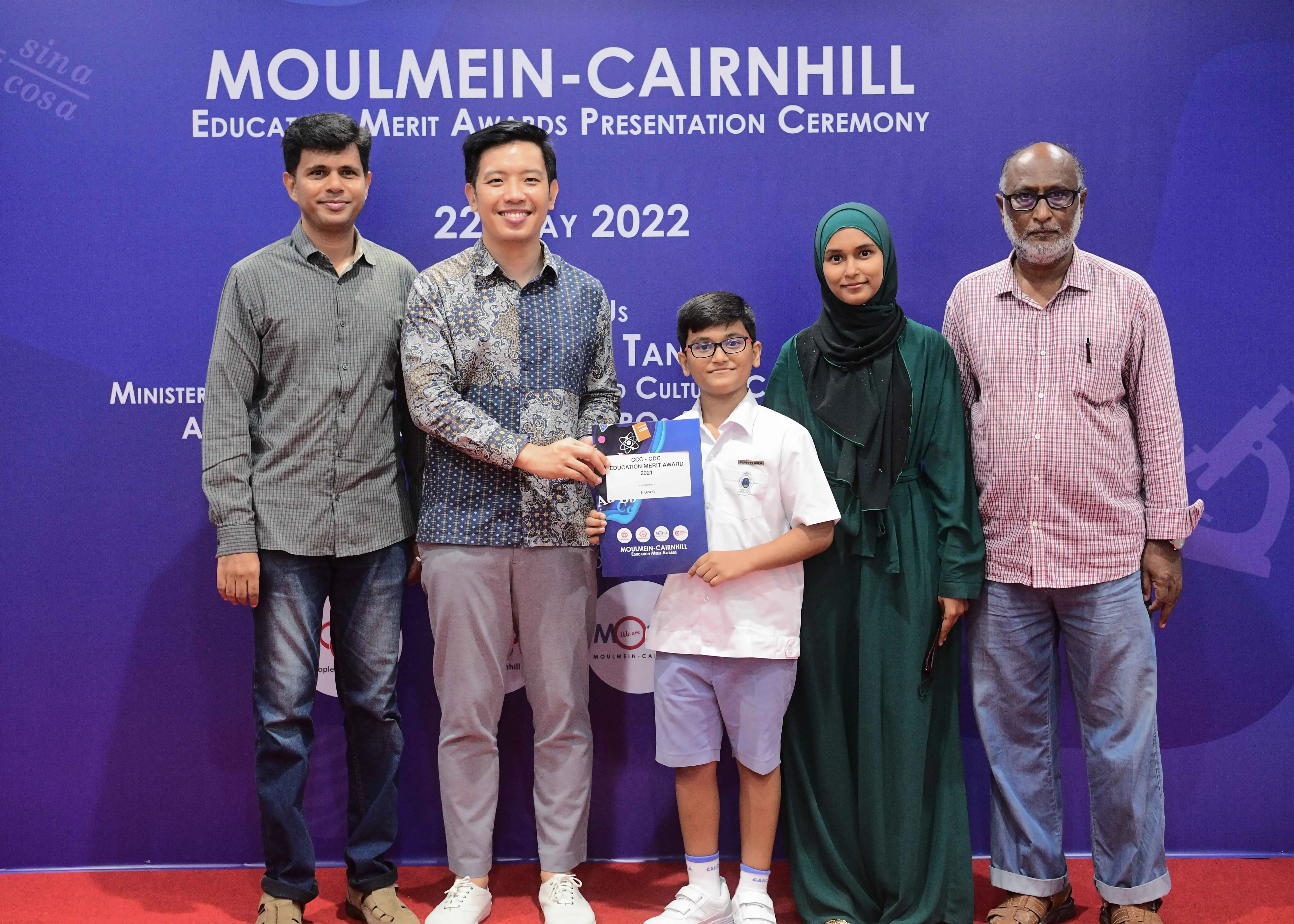 Five people pose at the Moulmein-Cairnhill Education Merit Awards Presentation Ceremony on 22 May 2022.