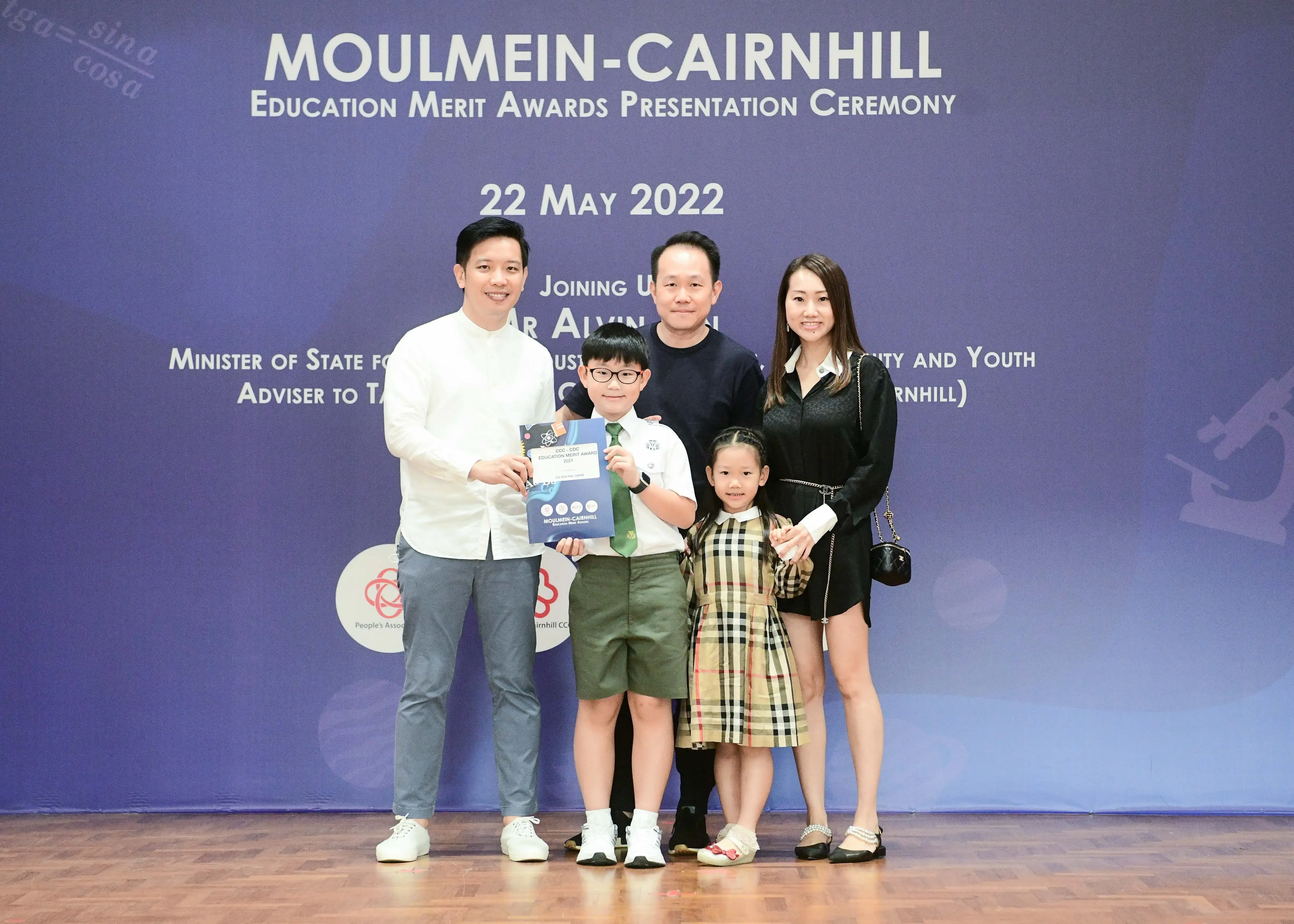 Five people pose at the Moulmein-Cairnhill Education Merit Awards Presentation Ceremony on 22 May 2022.