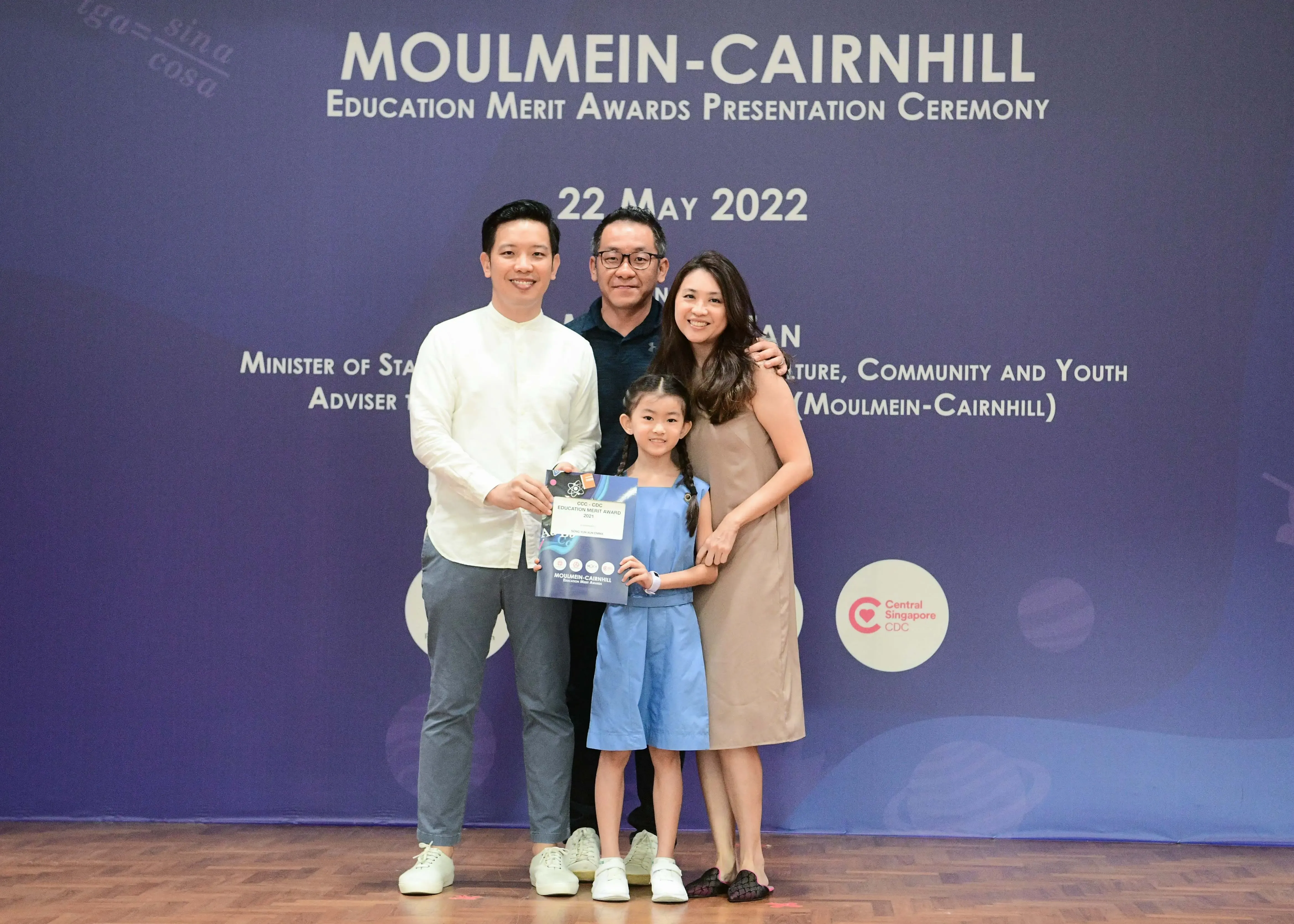 Four people pose at the Moulmein-Cairnhill Education Merit Awards Presentation Ceremony on 22 May 2022.