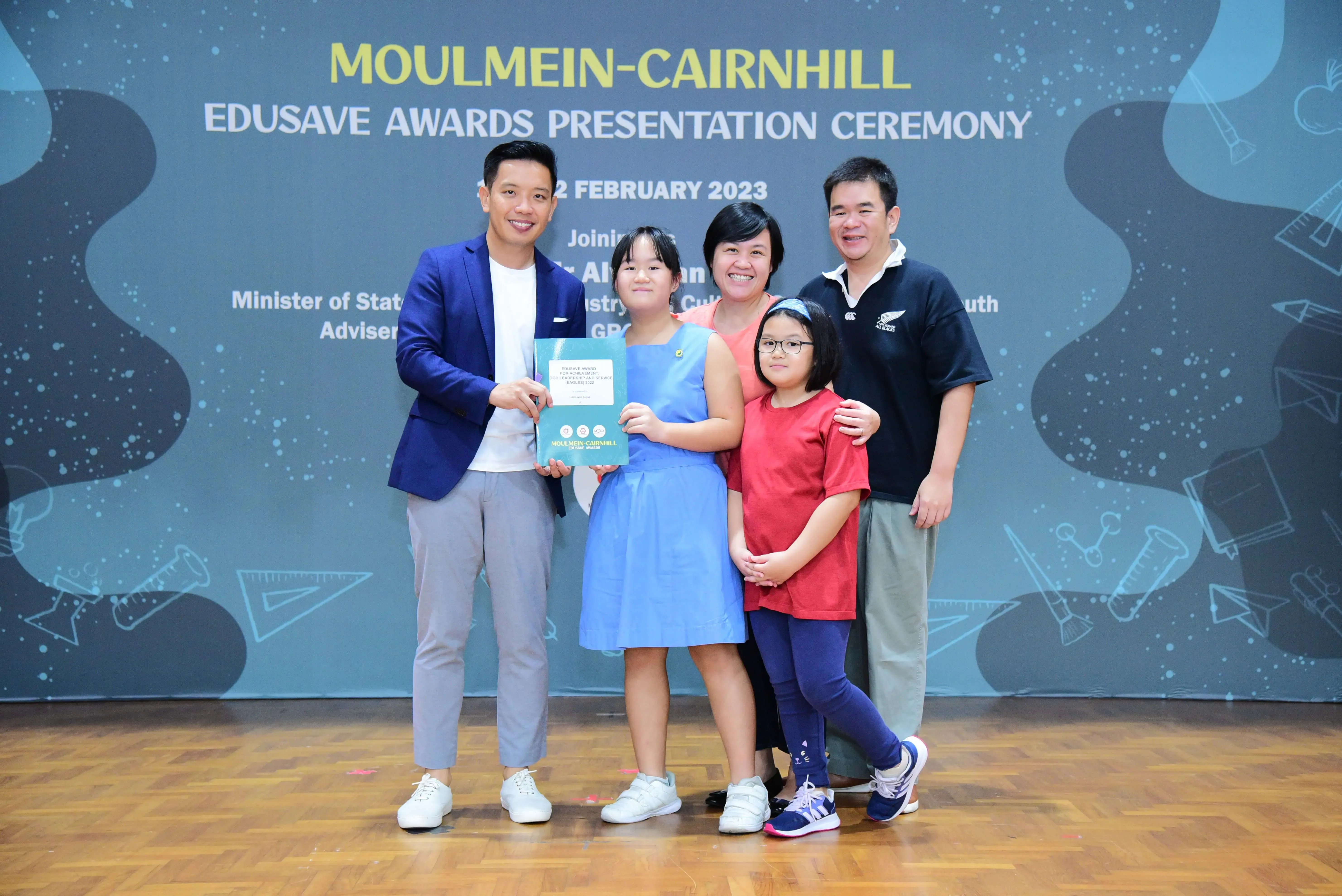 Five people pose at the Moulmein-Cairnhill Edusave Awards Presentation Ceremony on 2 February 2023.