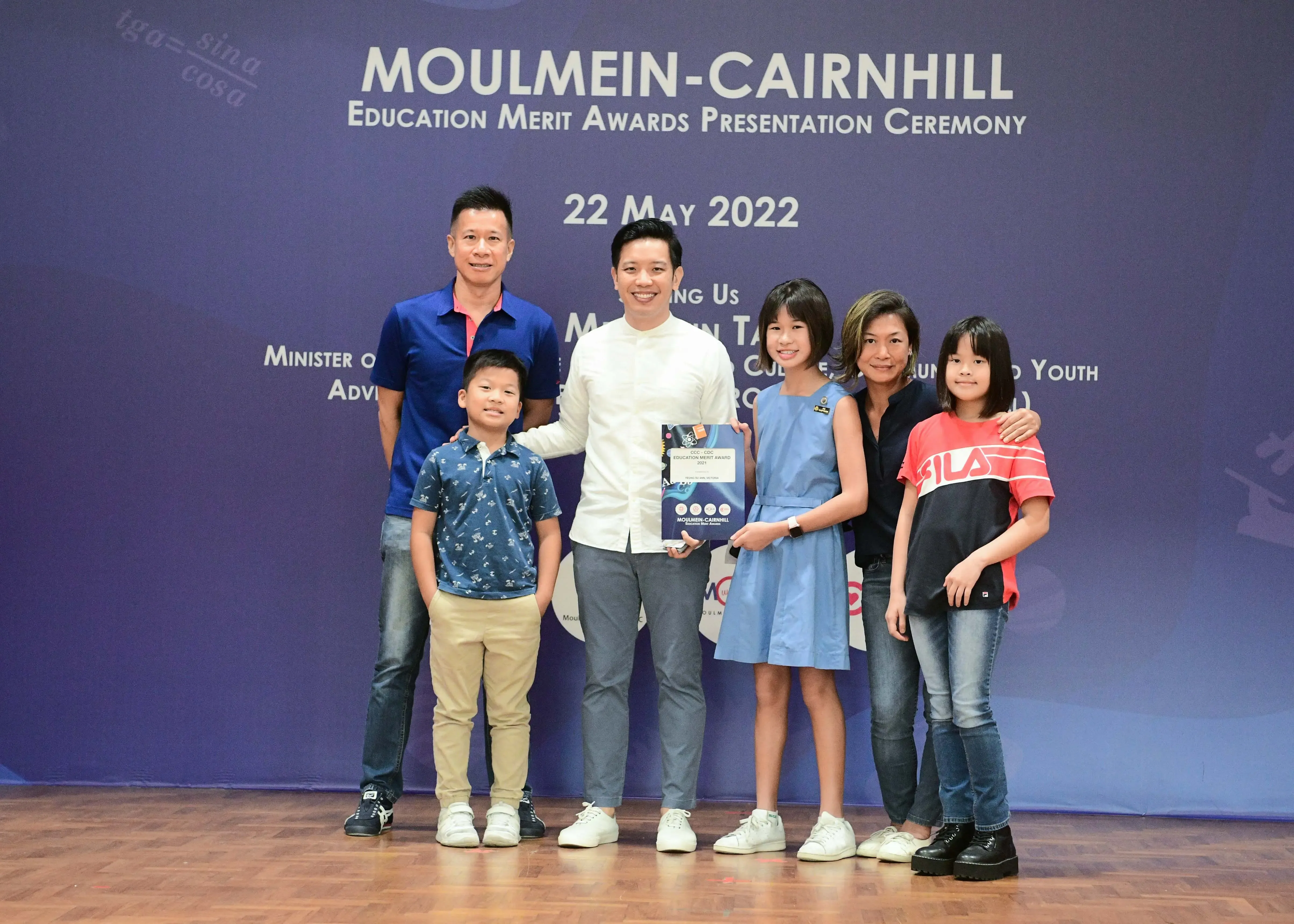 Six people pose at the Moulmein-Cairnhill Education Merit Awards Presentation Ceremony on 22 May 2022.