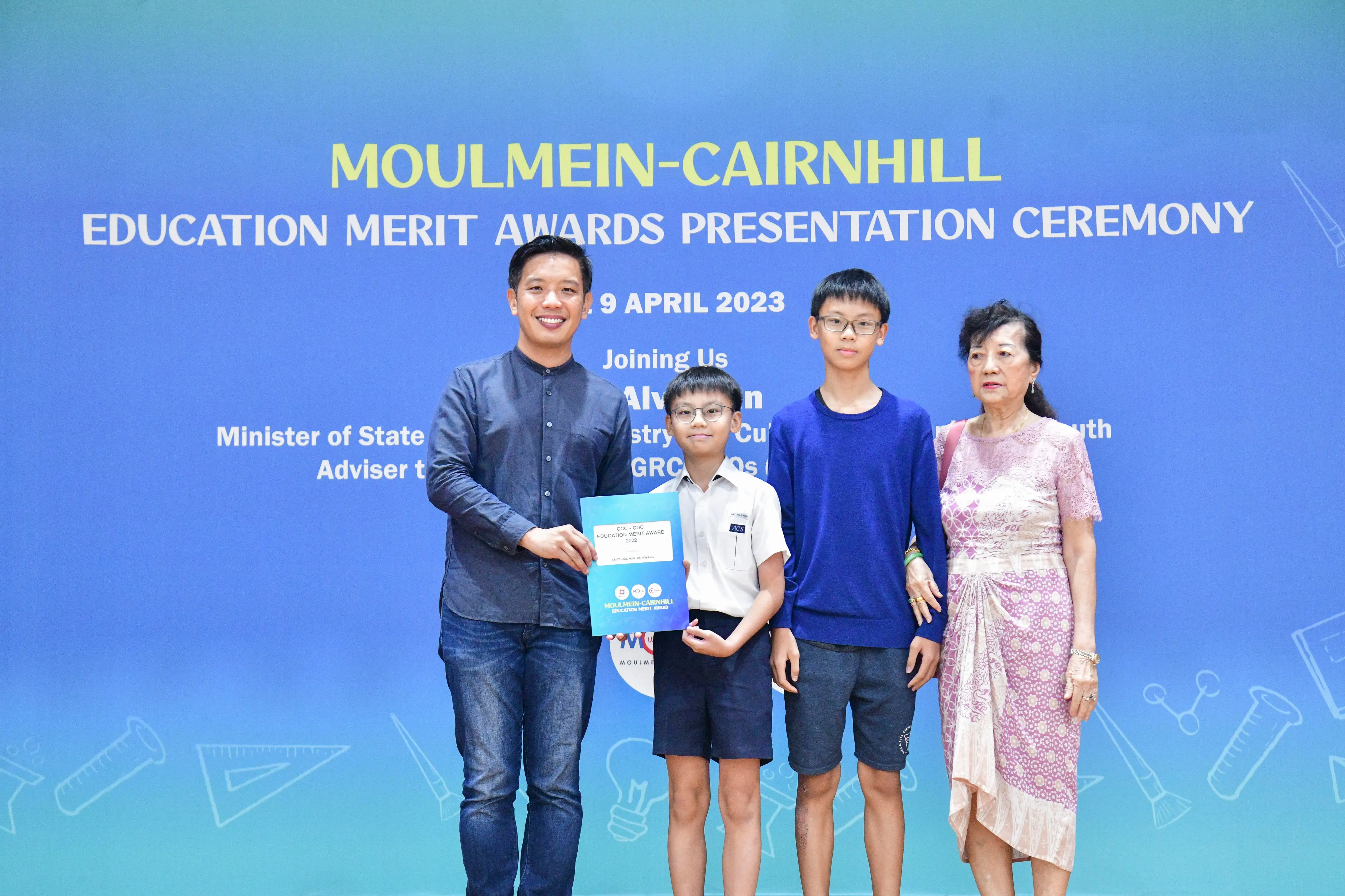 Four people pose at the Moulmein-Cairnhill Education Merit Awards Presentation Ceremony on 9 April 2023.