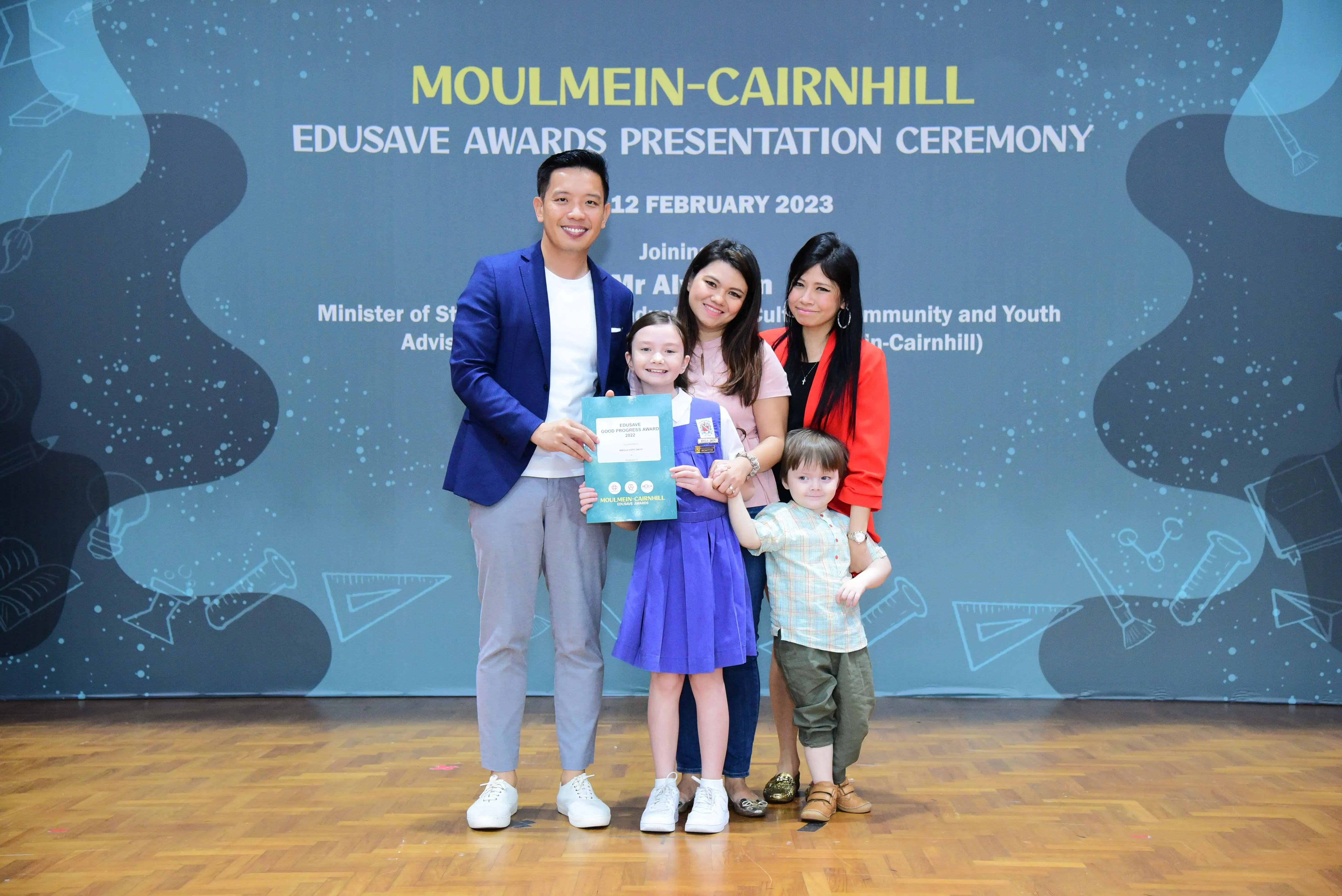 Five people pose at the Moulmein-Cairnhill Edusave Awards Presentation Ceremony on 12 February 2023.