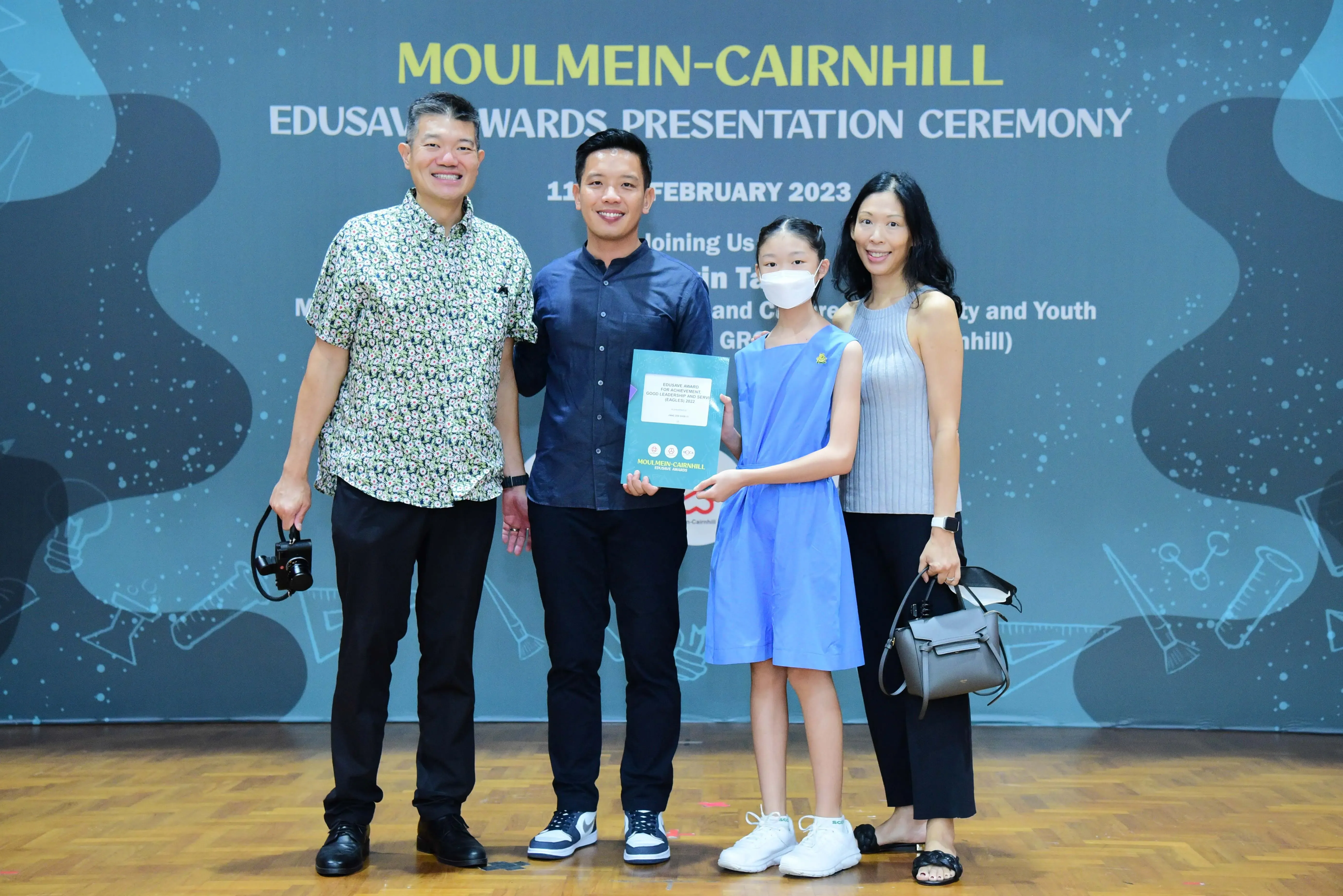 Four people pose at the Moulmein-Cairnhill Edusave Awards Presentation Ceremony on 11 February 2023.