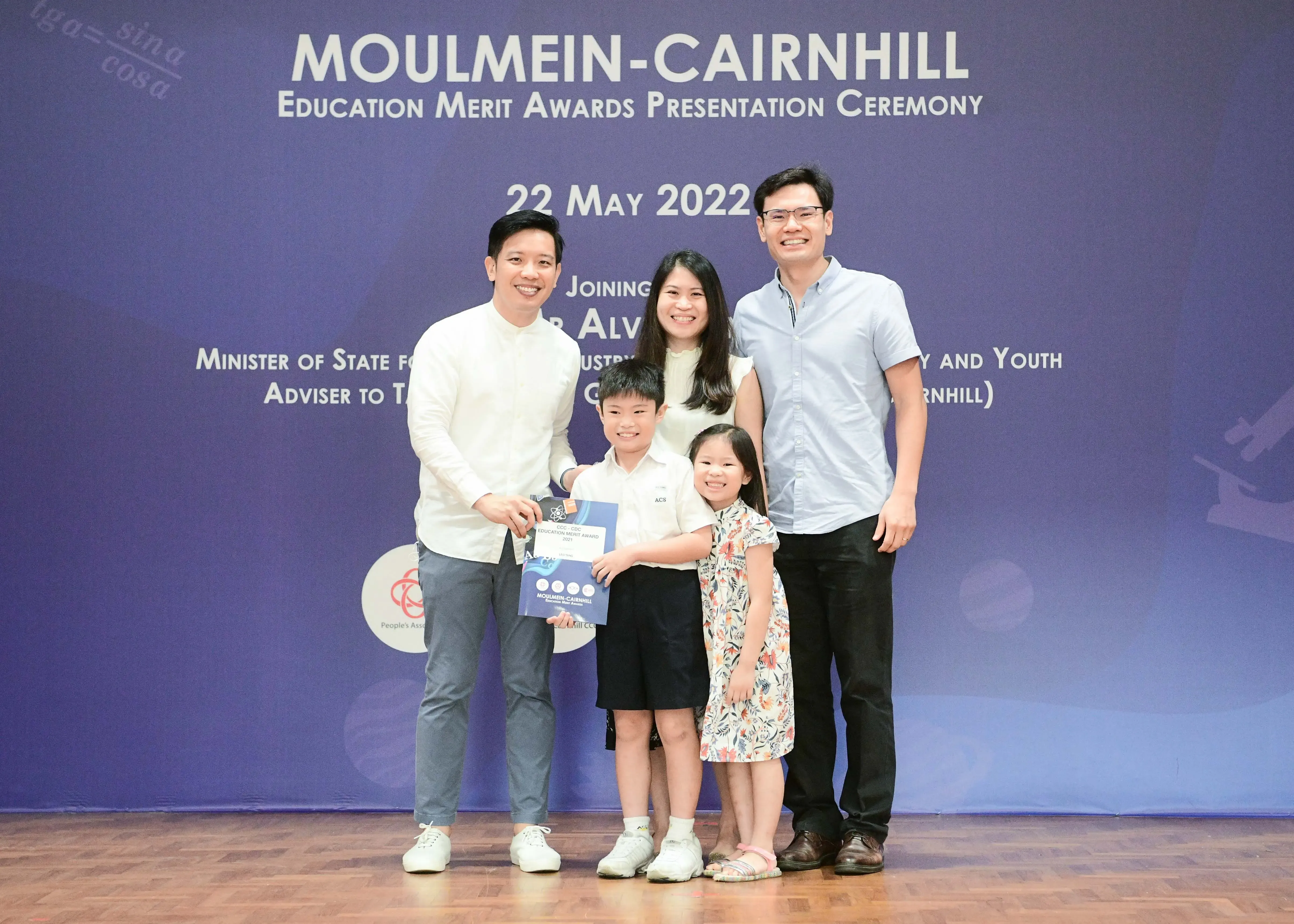 Five people pose at the Moulmein-Cairnhill Education Merit Awards Presentation Ceremony on 22 May 2022.