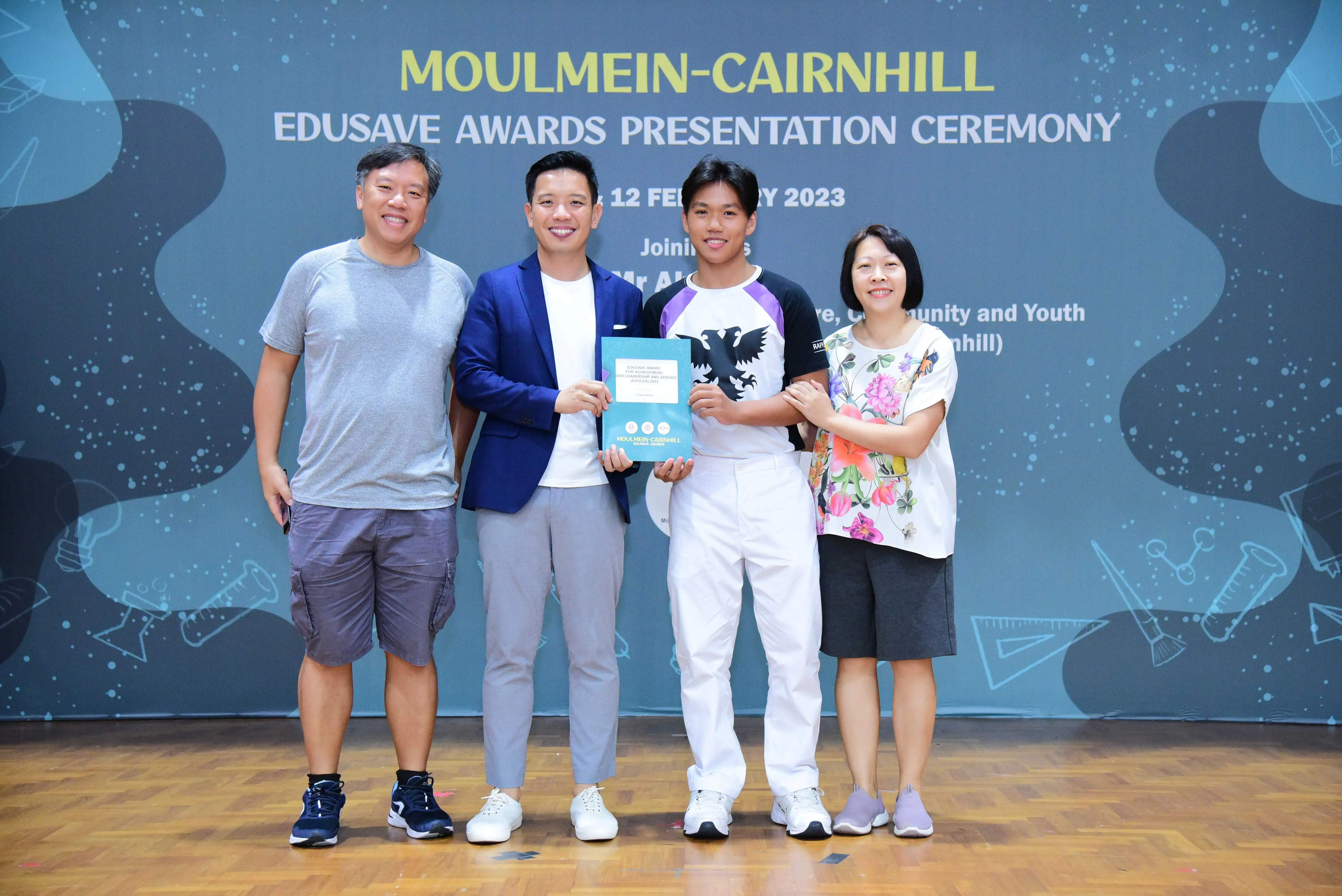 Four people pose at the Moulmein-Cairnhill Edusave Awards Presentation Ceremony on 12 February 2023.