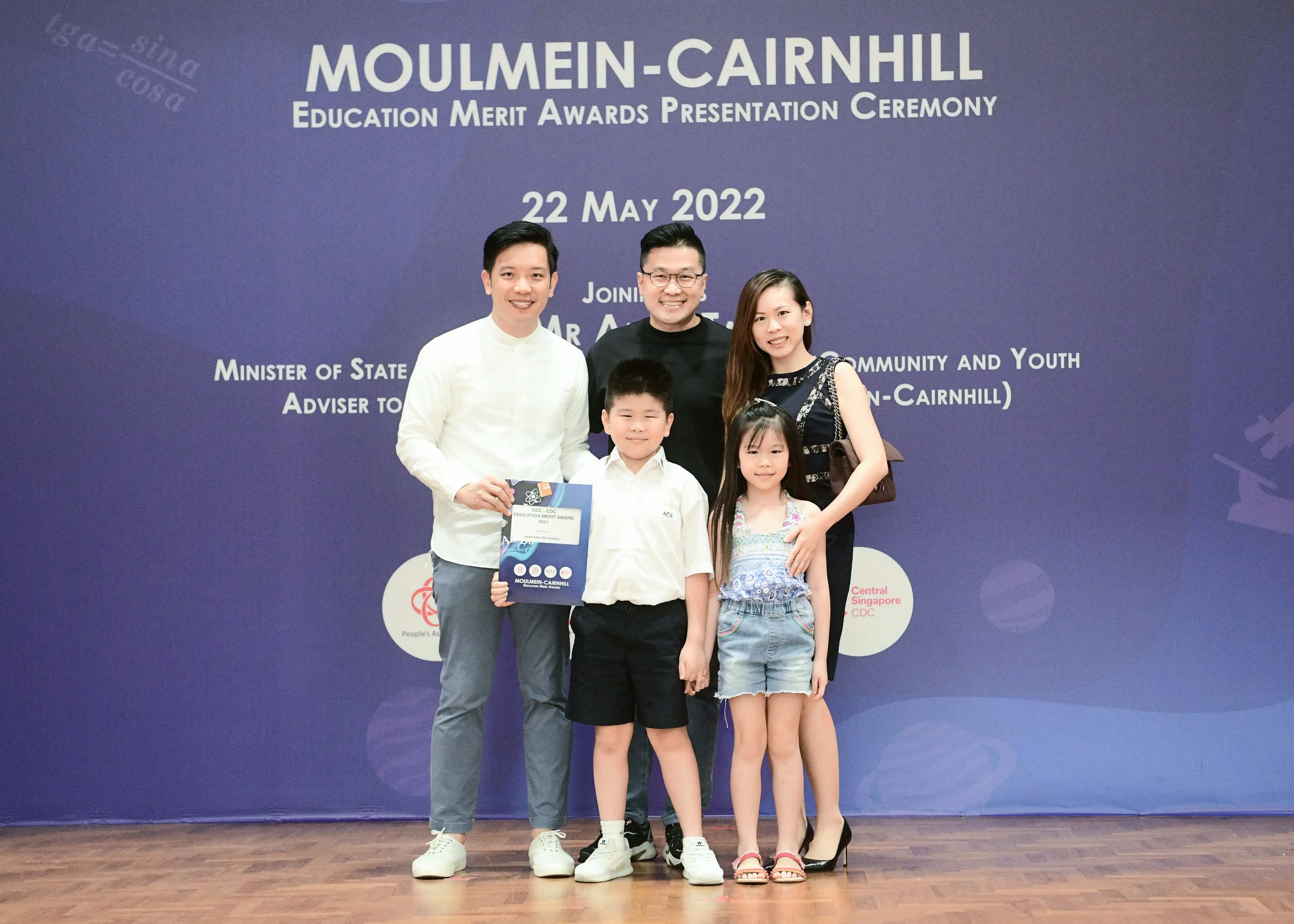Five people pose at the Moulmein-Cairnhill Education Merit Awards Presentation Ceremony on 22 May 2022.