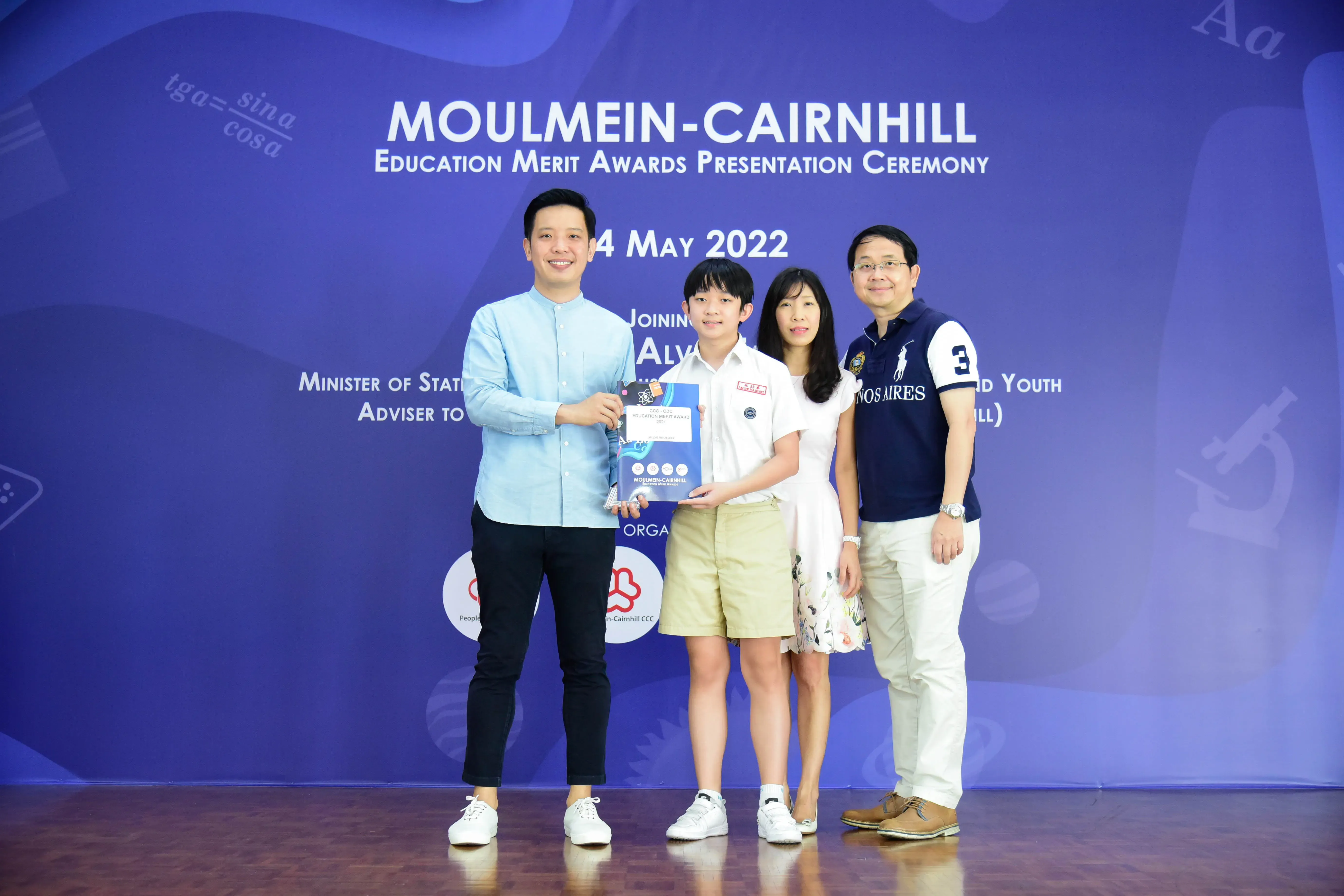 Four people pose at the Moulmein-Cairnhill Education Merit Awards Presentation Ceremony on 4 May 2022.