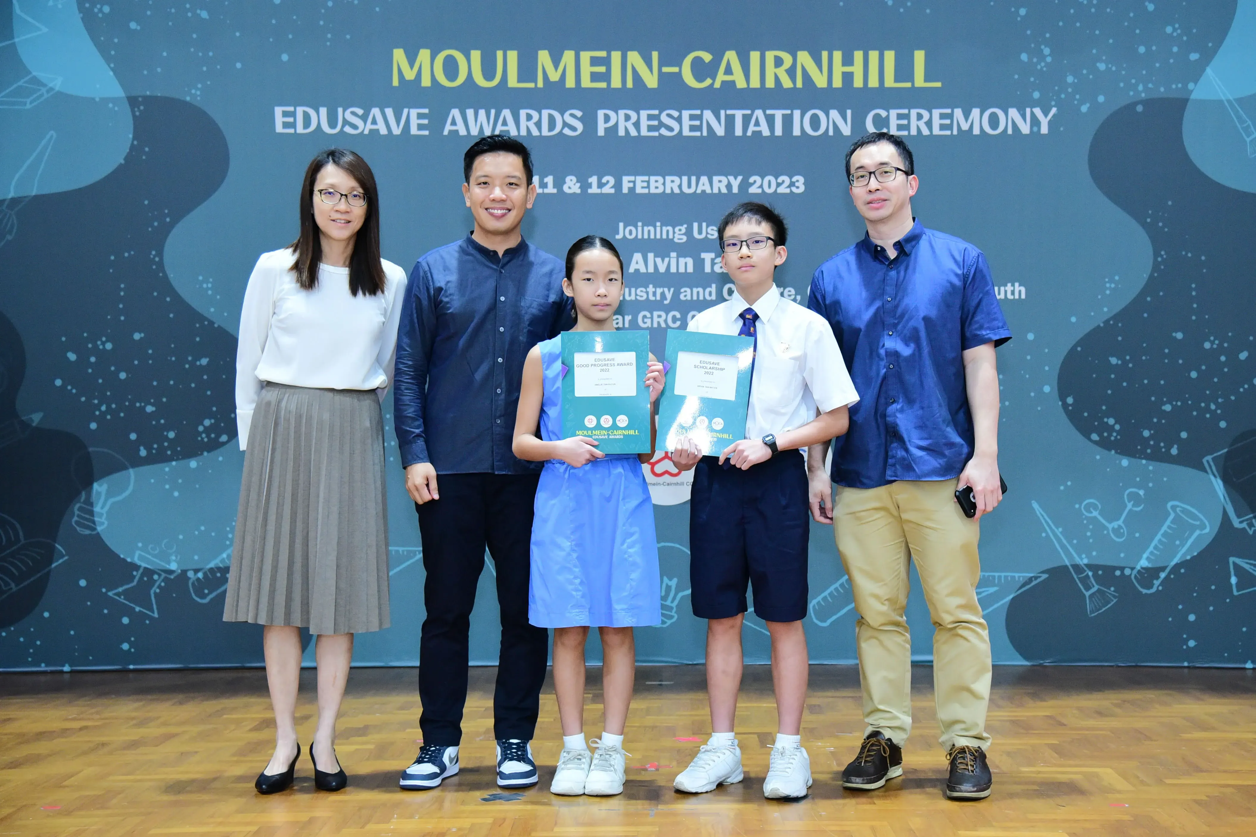 Five people pose at the Moulmein-Cairnhill Edusave Awards Presentation Ceremony on 11-12 February 2023.