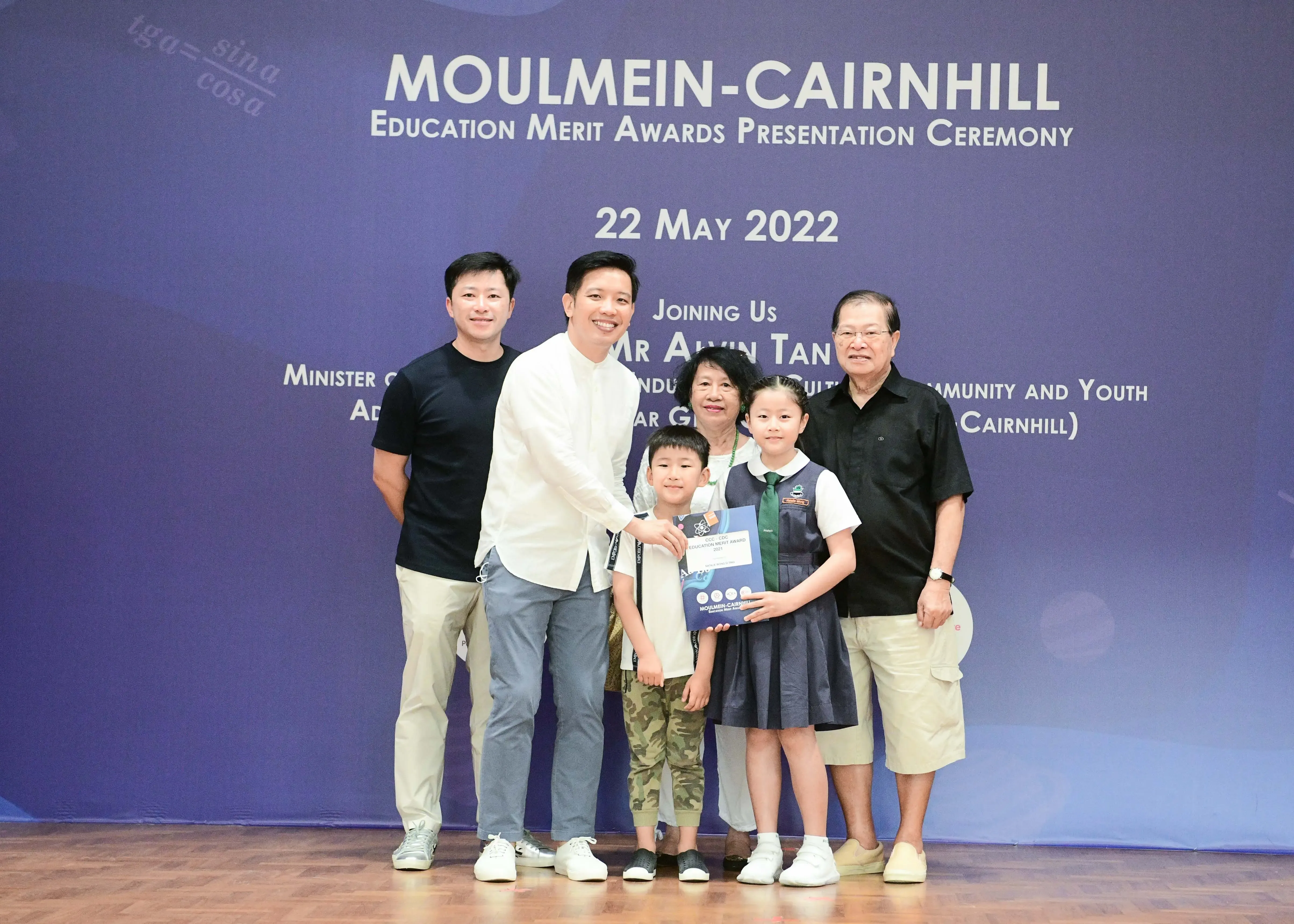 Six people pose at the Moulmein-Cairnhill Education Merit Awards Presentation Ceremony on 22 May 2022.