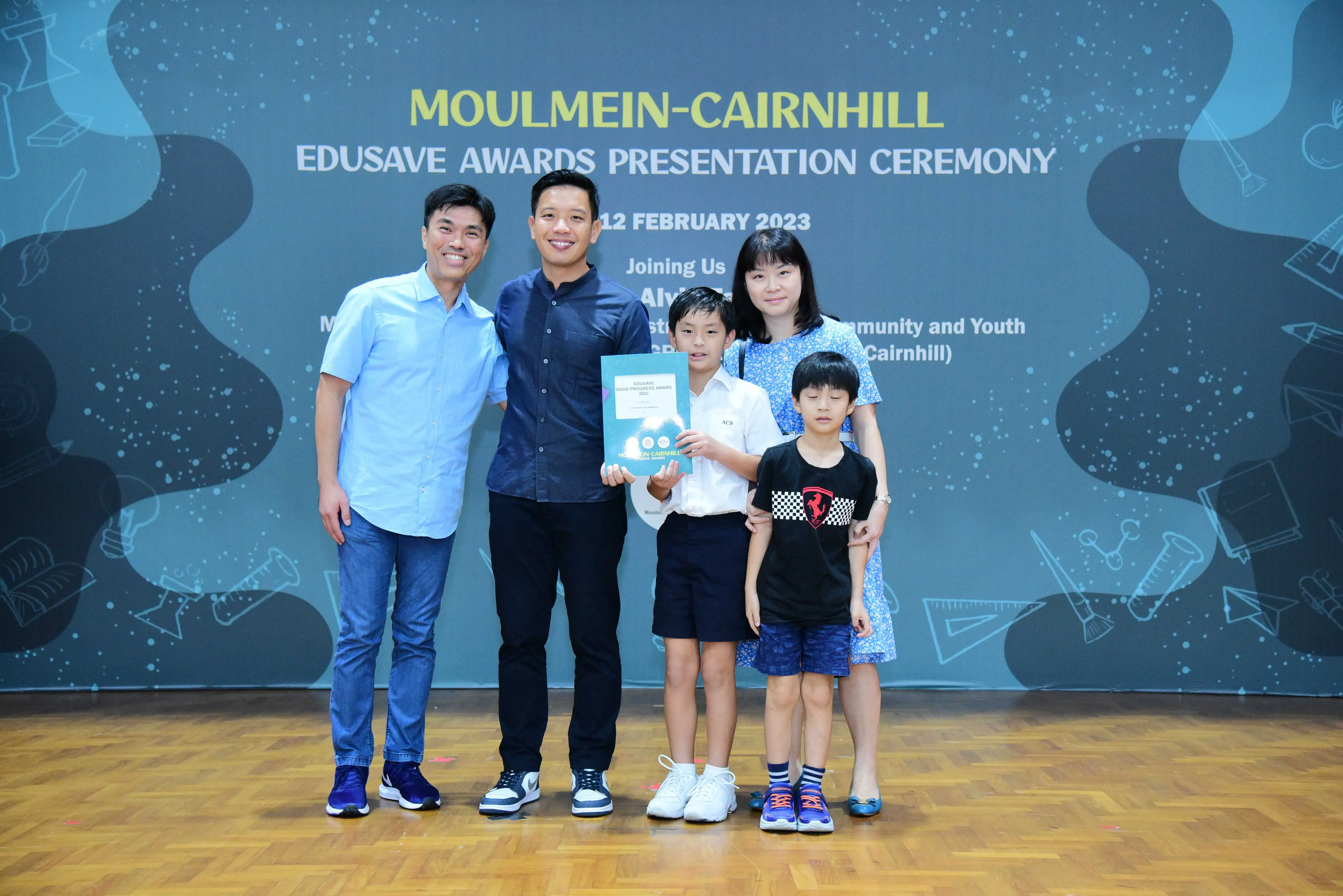Five people pose at the Moulmein-Cairnhill Edusave Awards Presentation Ceremony on 12 February 2023.